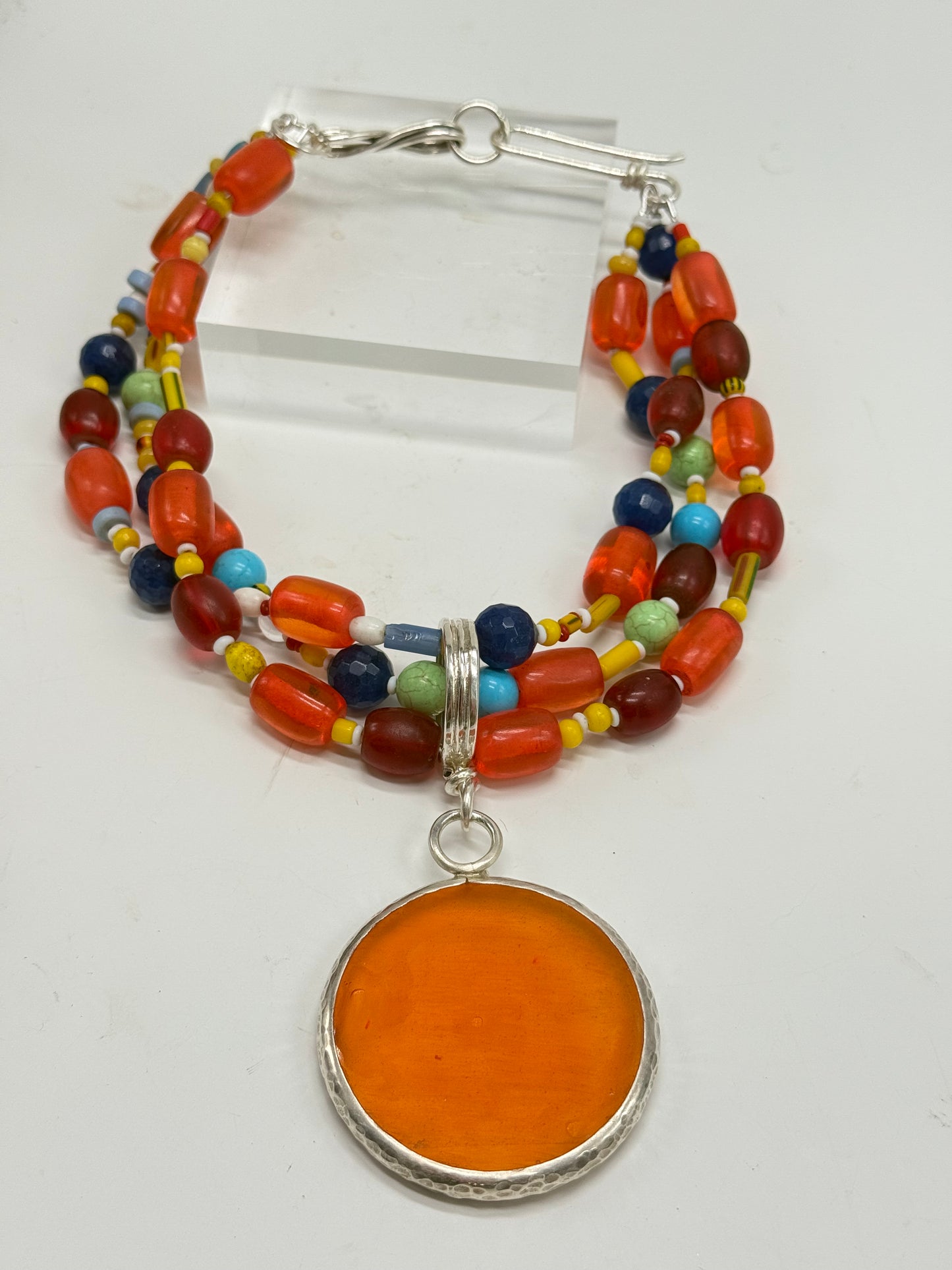 Multi coloured/multi strand with yellow/orange resin & silver pendant -semi precious stones with Sterling silver catch
