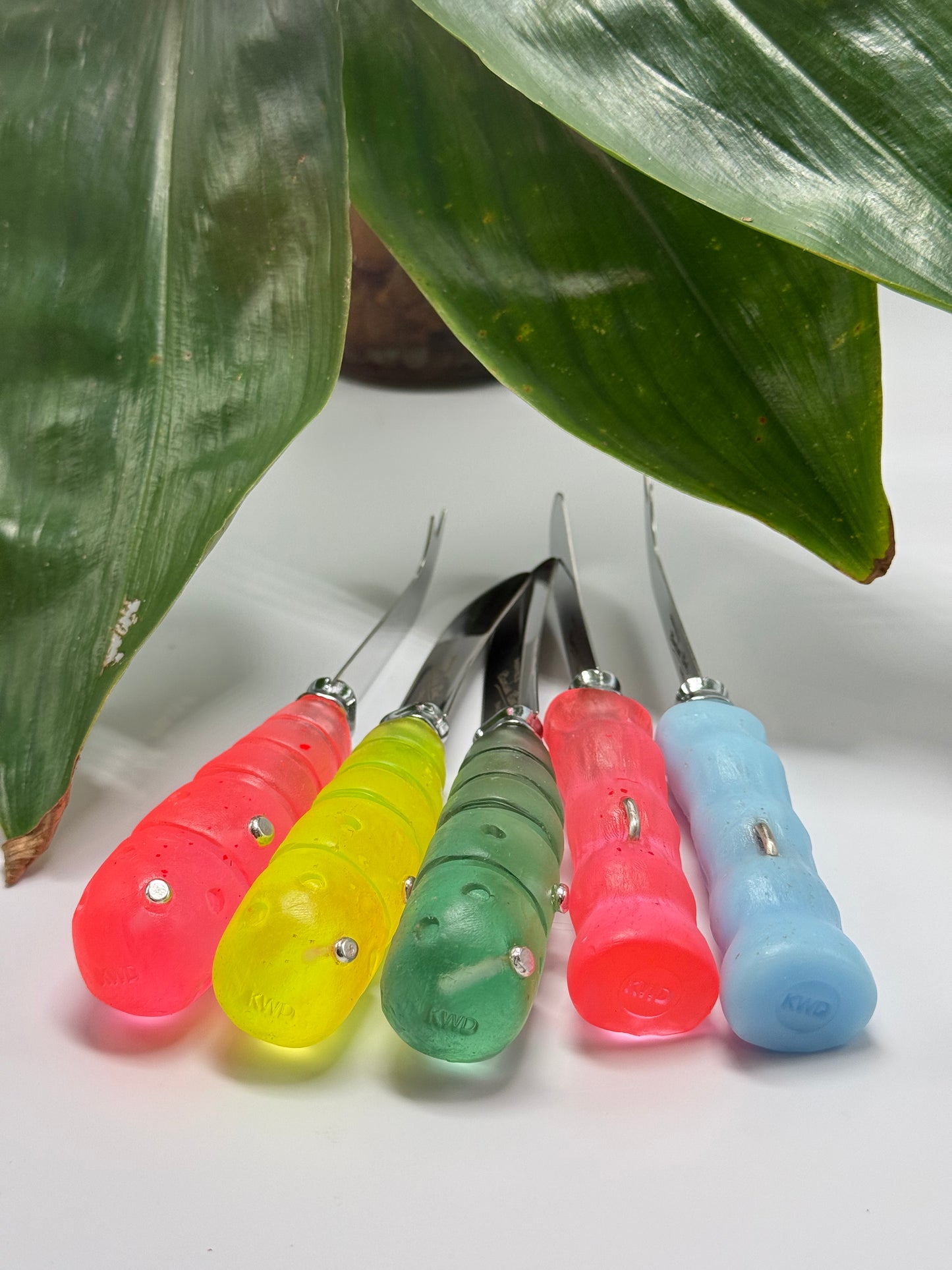 Cheese knife - Pale Blue resin - irregular shaped handle with silver staple insert