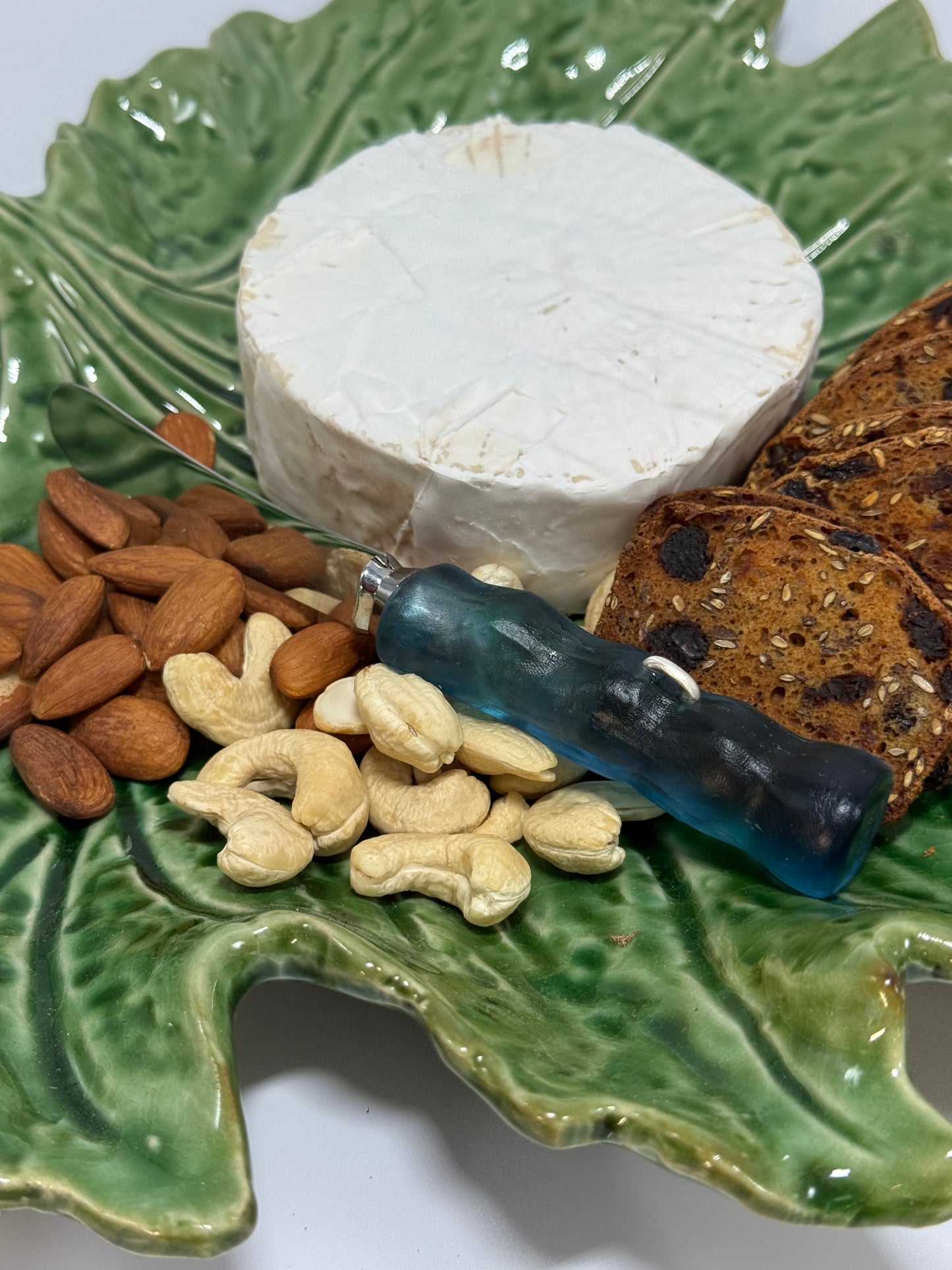 Cheese knife - Translucent blue/green resin - irregular shaped handle with silver staple insert