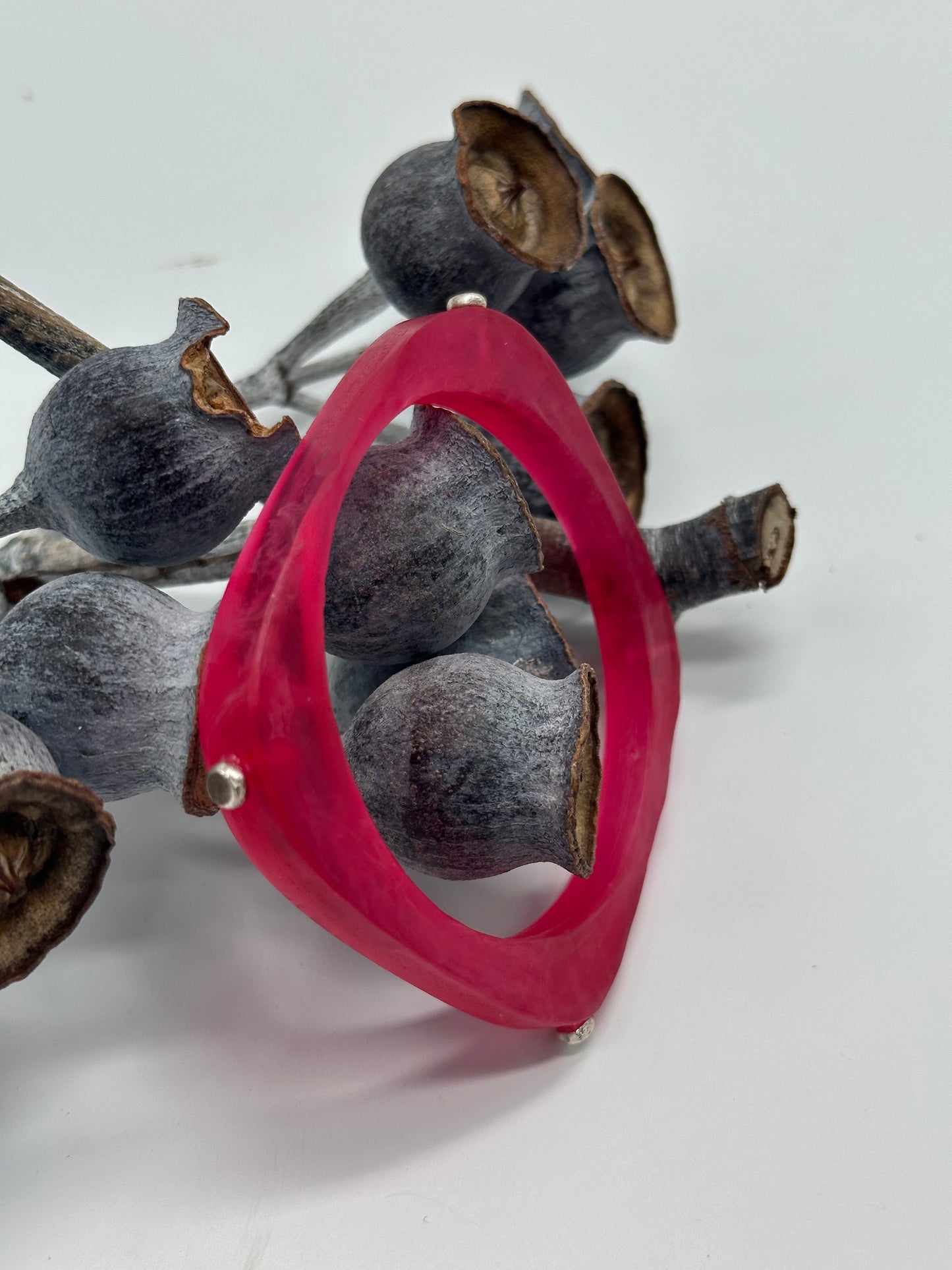 Translucent red 'square round' bangle with silver