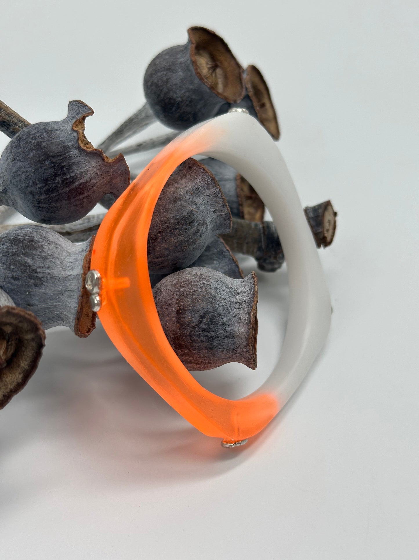 Two toned orange/white 'square round' bangle with silver