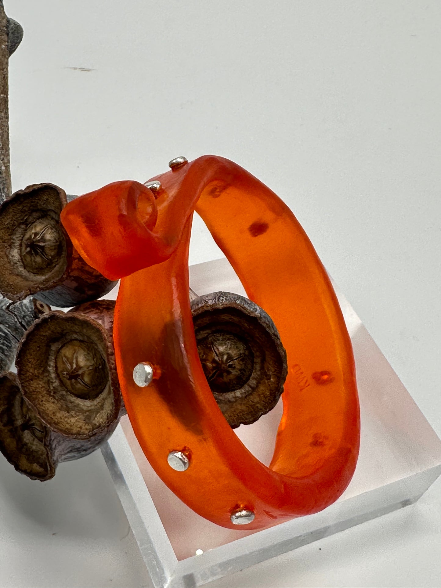 Orange 'Curl' Resin and silver bangle