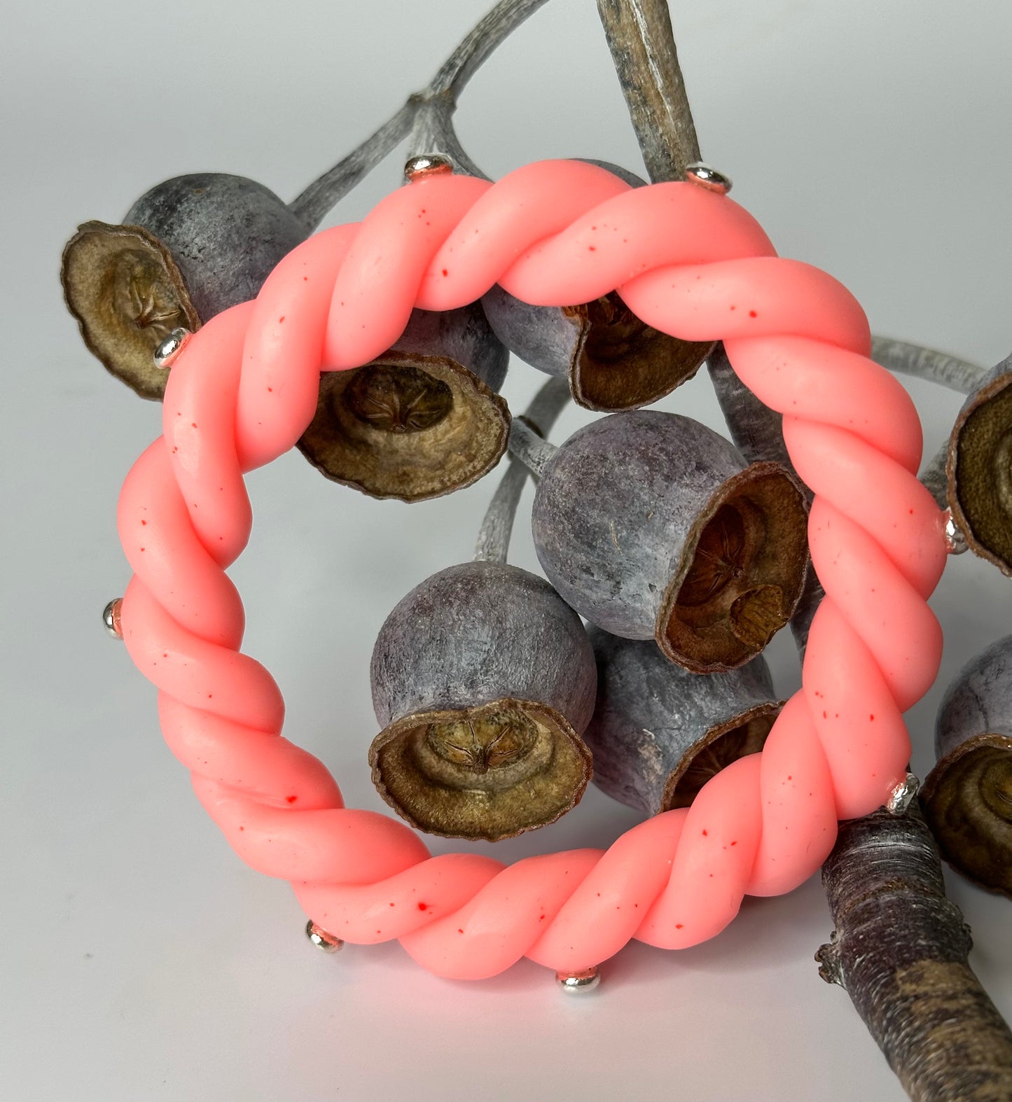 Neon Coral twisted resin & silver bangle