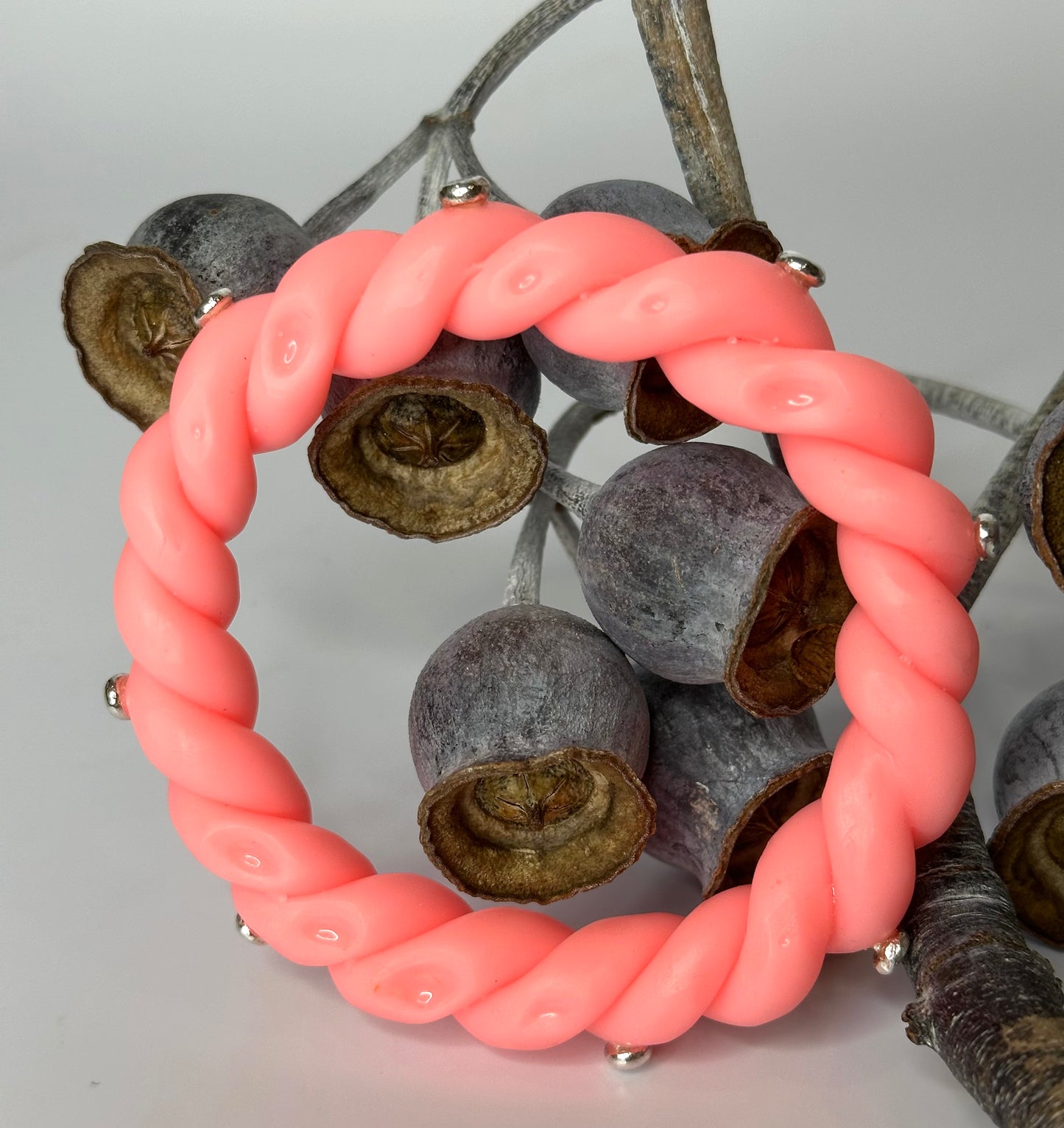 Neon Coral twisted resin & silver bangle