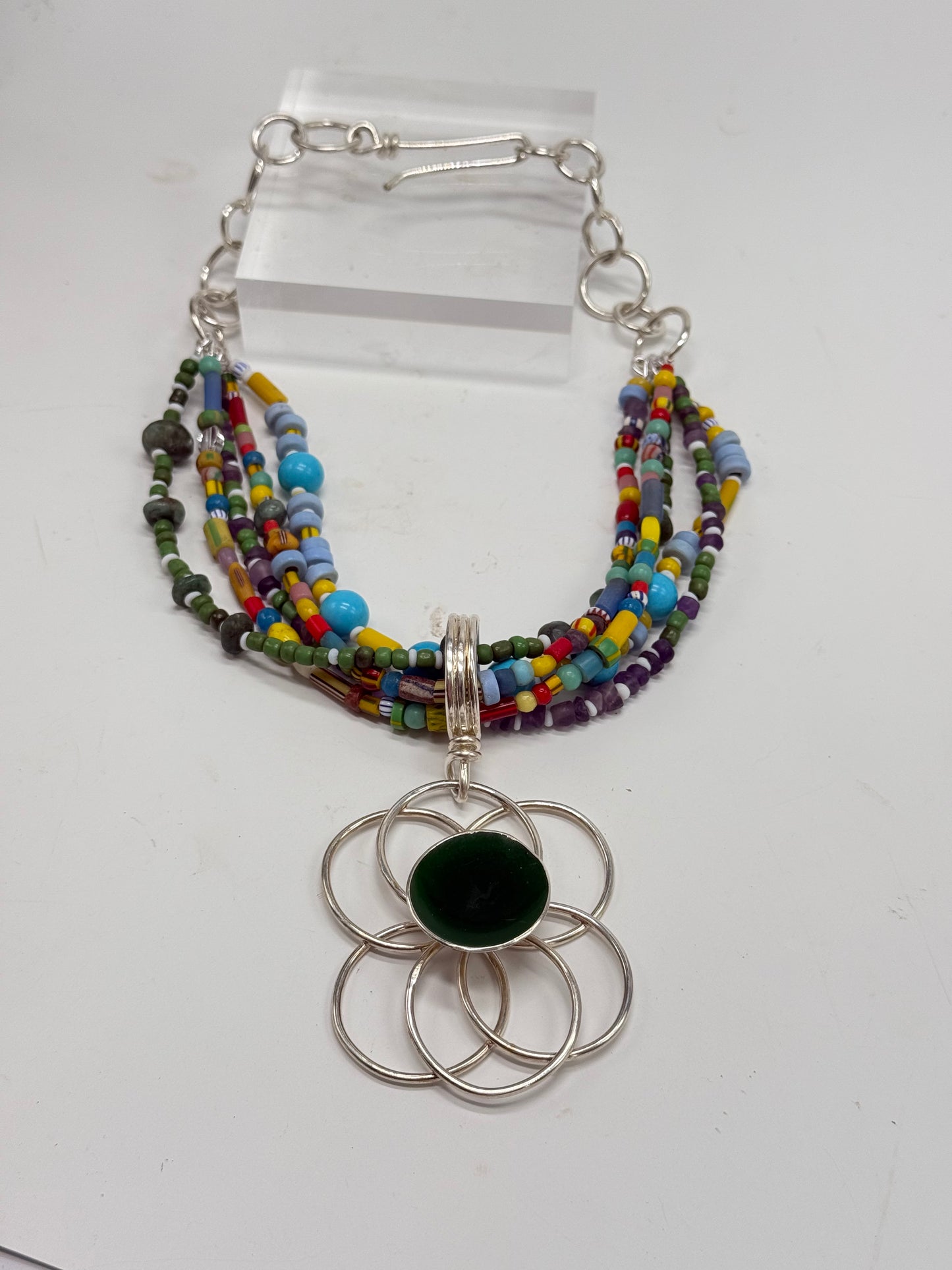Multi coloured/multi strand with green resin & silver floral pendant -semi precious stones with Sterling silver links & catch