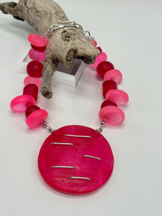 Handmade Hot pink & red resin beads with sterling silver staple in the centre piece