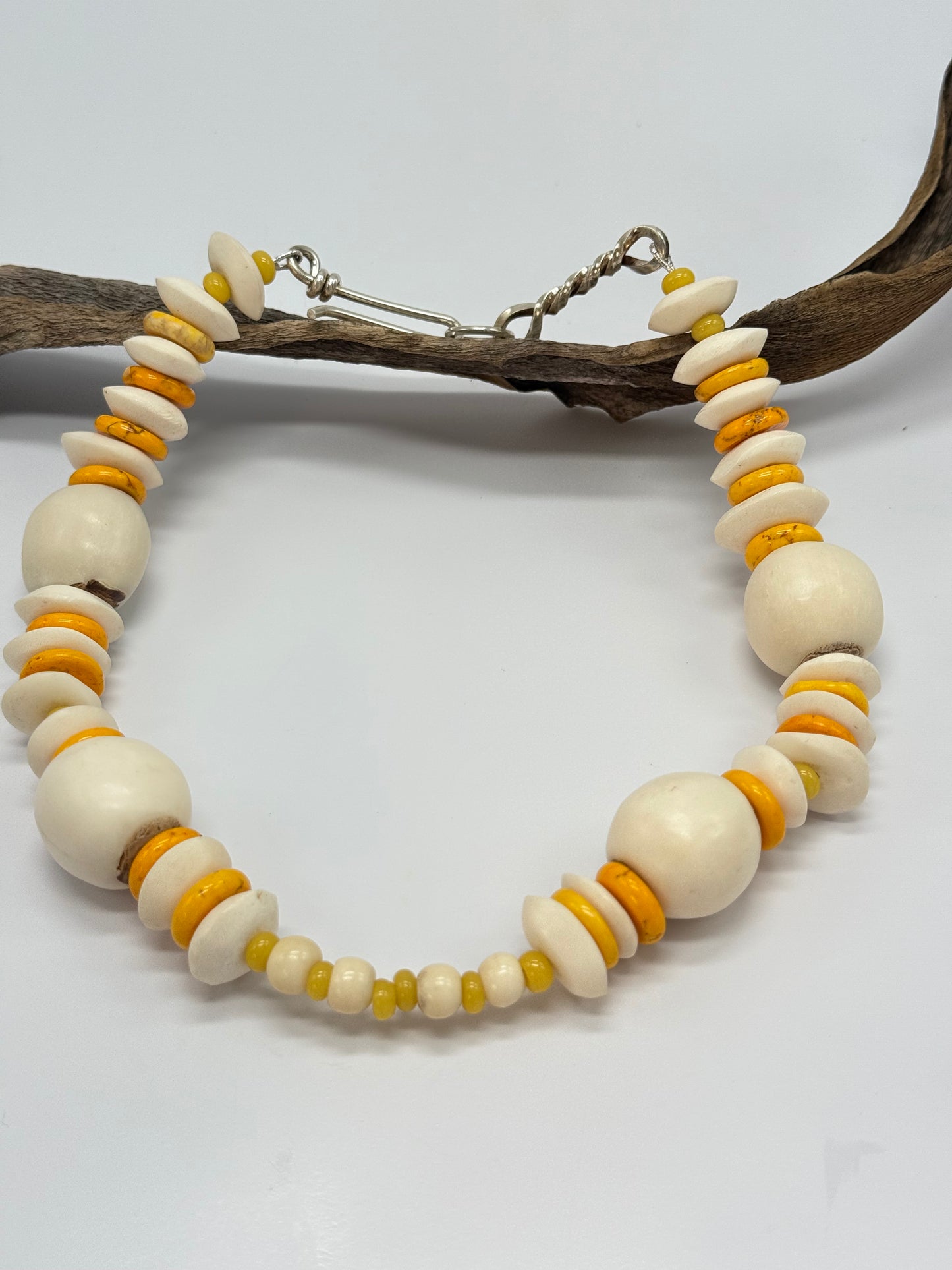 Yellow semi precious stones & bone beads with Sterling silver catch
