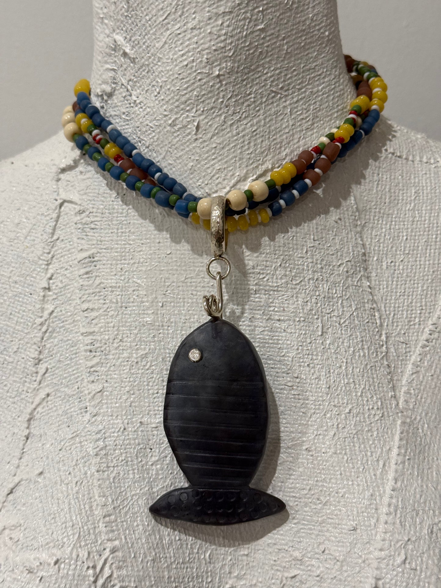 Multi coloured/multi strand with beaten sterling silver circle that can have any pendant added