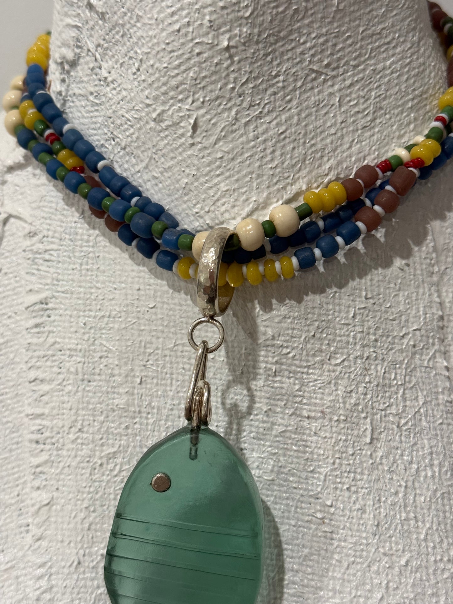 Multi coloured/multi strand with beaten sterling silver circle that can have any pendant added