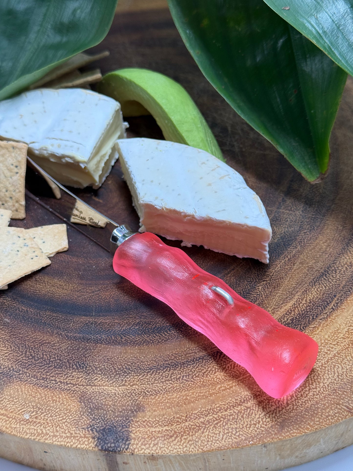 Cheese knife - Neon Red resin - irregular shaped handle with silver staple insert