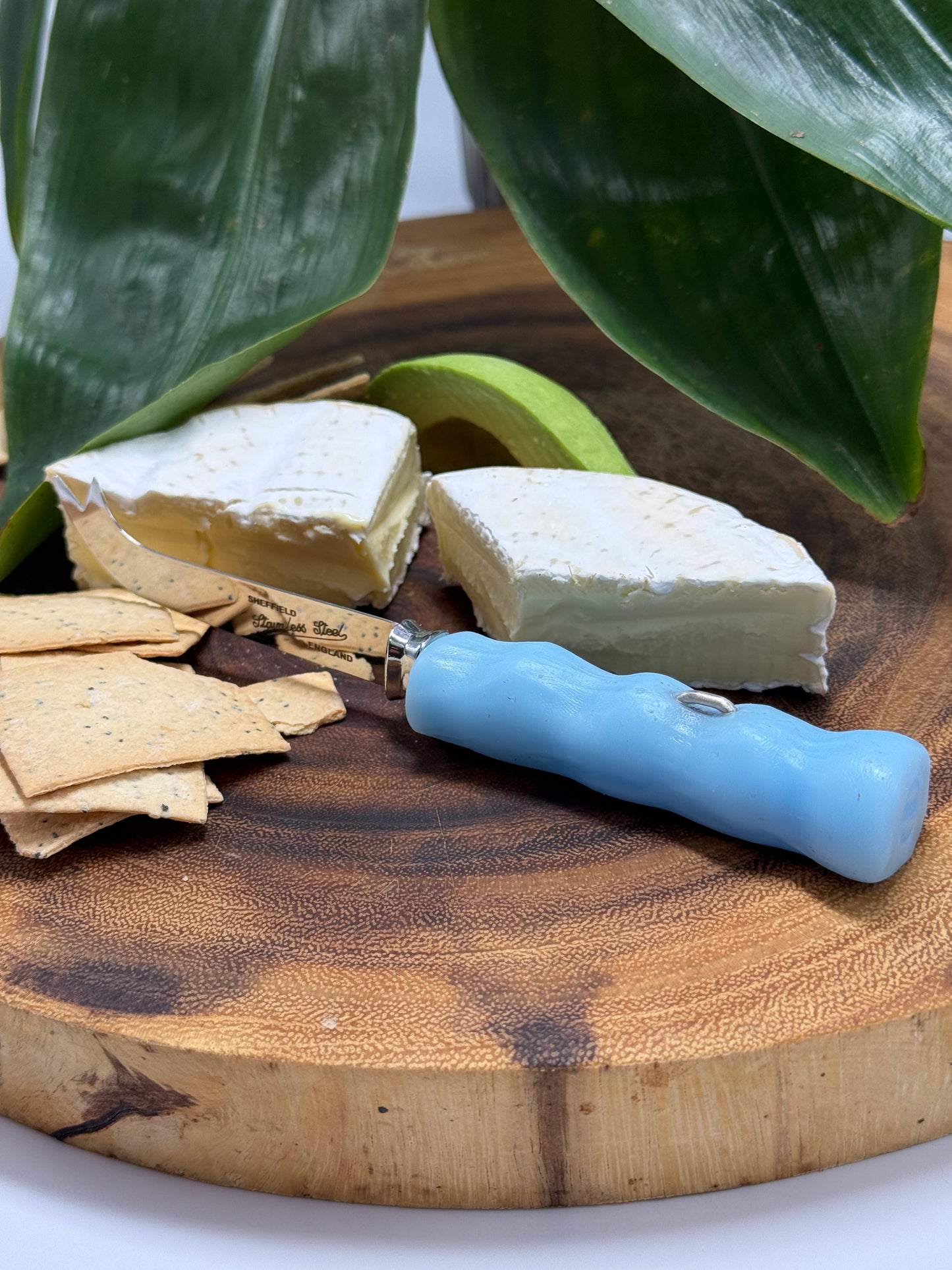 Cheese knife - Pale Blue resin - irregular shaped handle with silver staple insert
