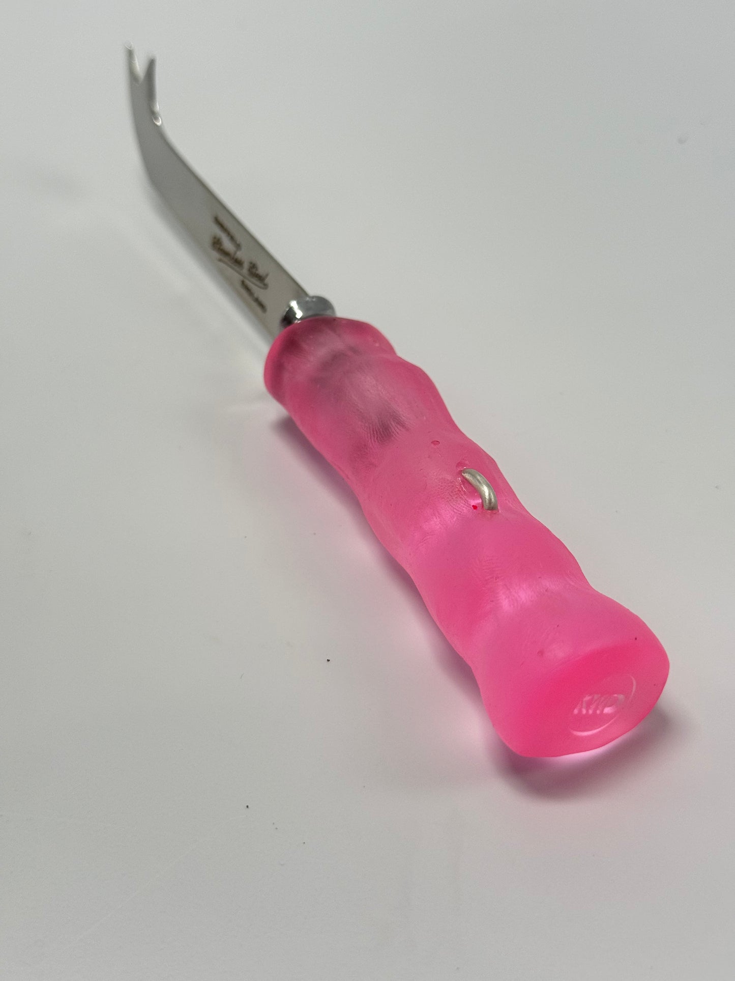 Cheese knife - Translucent Pink resin - irregular shaped handle with silver staple insert