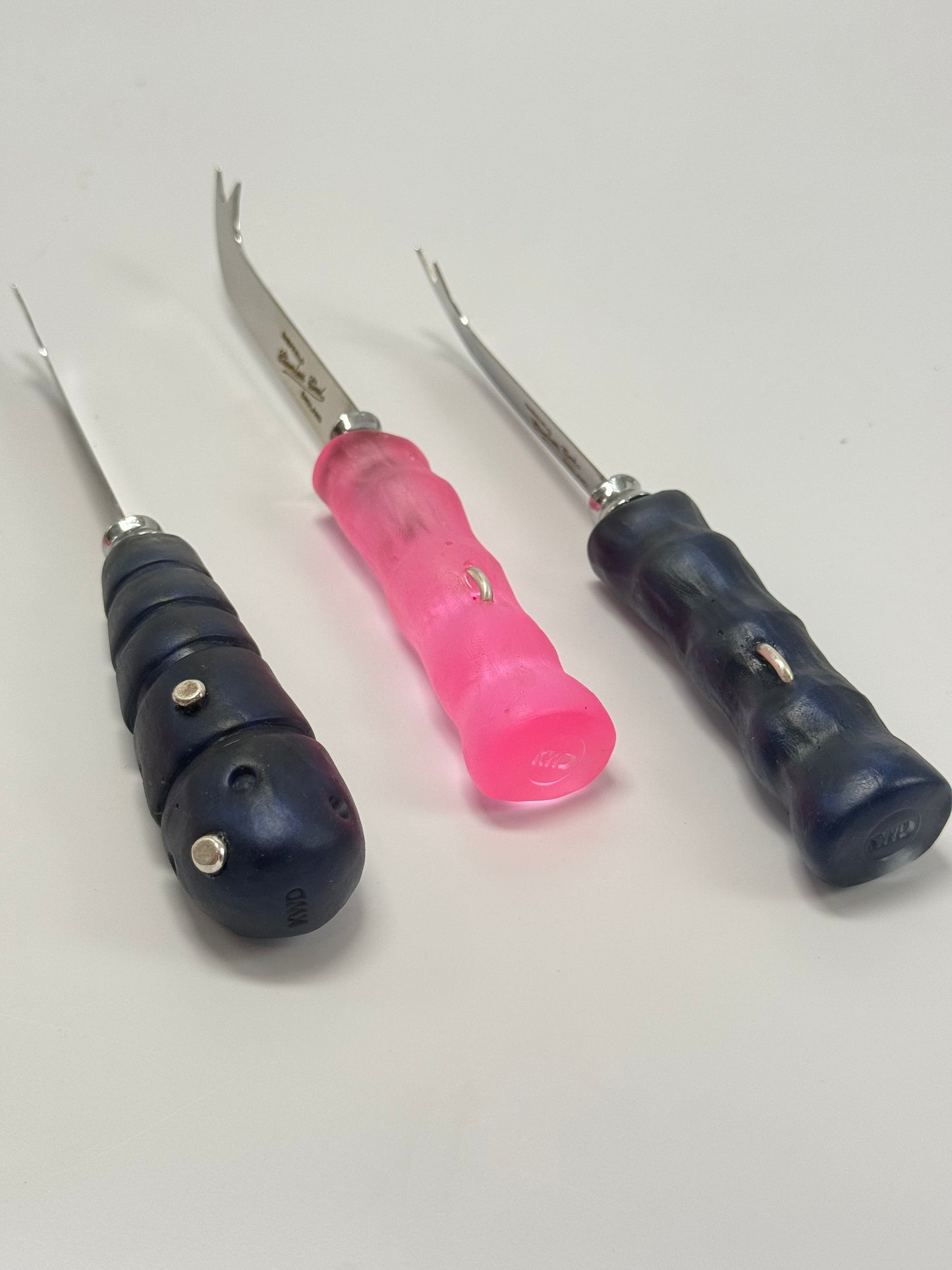 Cheese knife - Translucent Pink resin - irregular shaped handle with silver staple insert