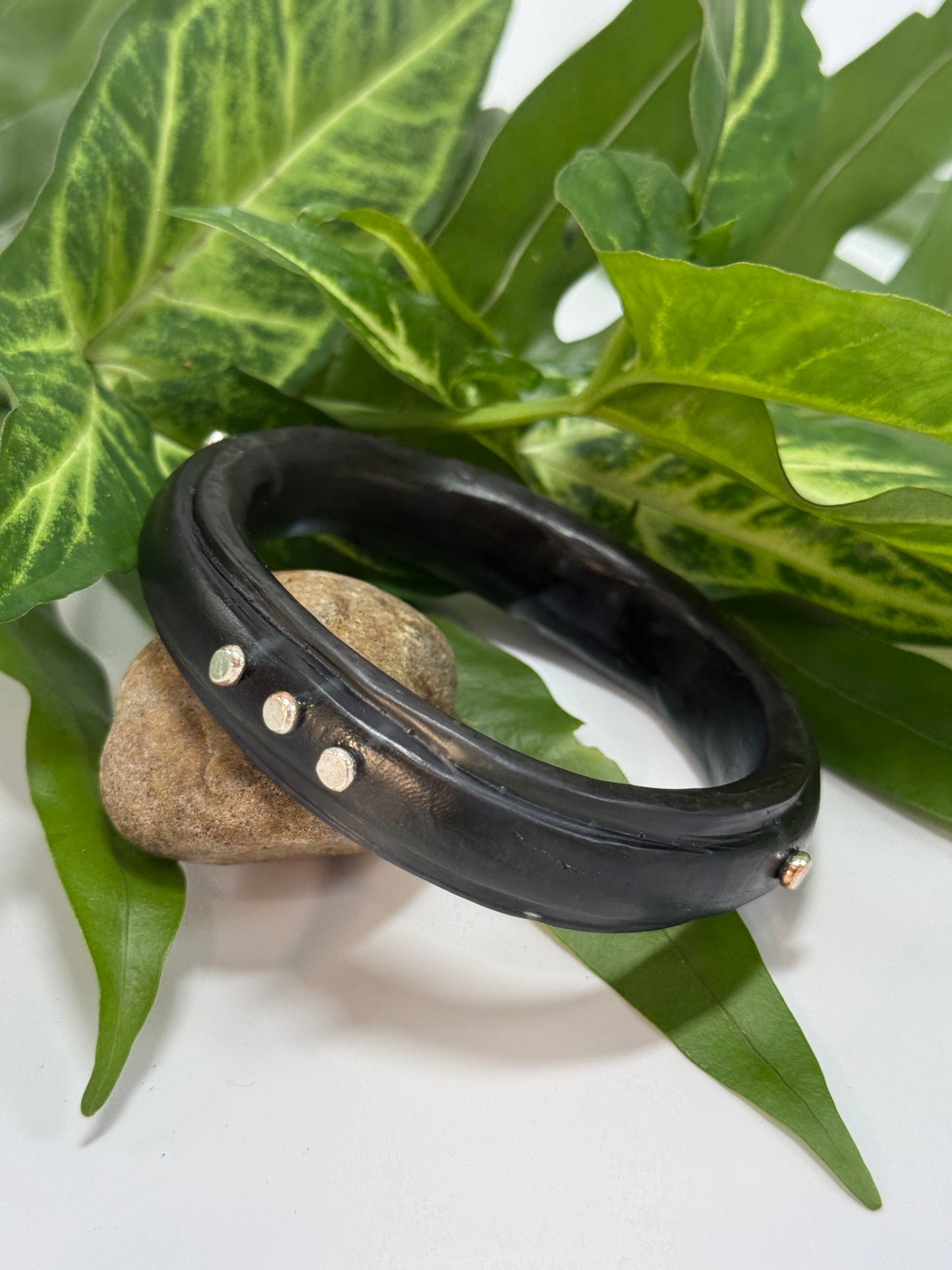 Translucent black coloured resin rim bangle with sterling silver rivets