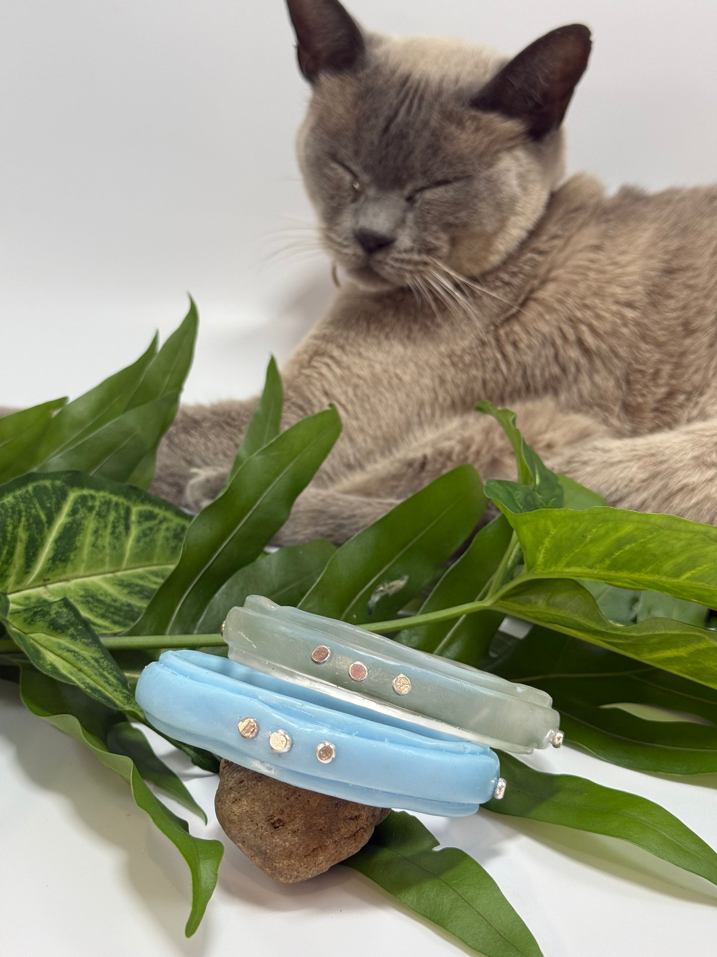 Baby blue coloured resin rim bangle with sterling silver rivets