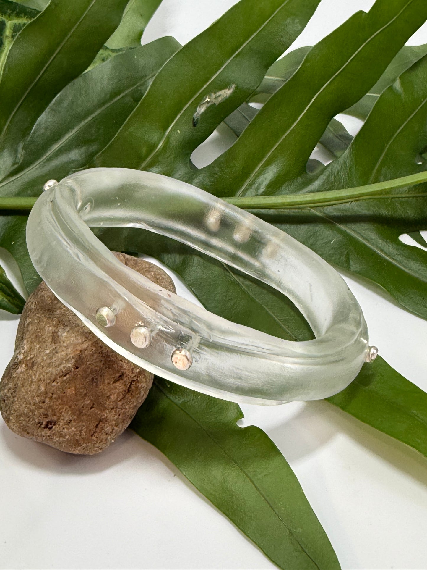 Clear resin rim bangle with sterling silver rivets