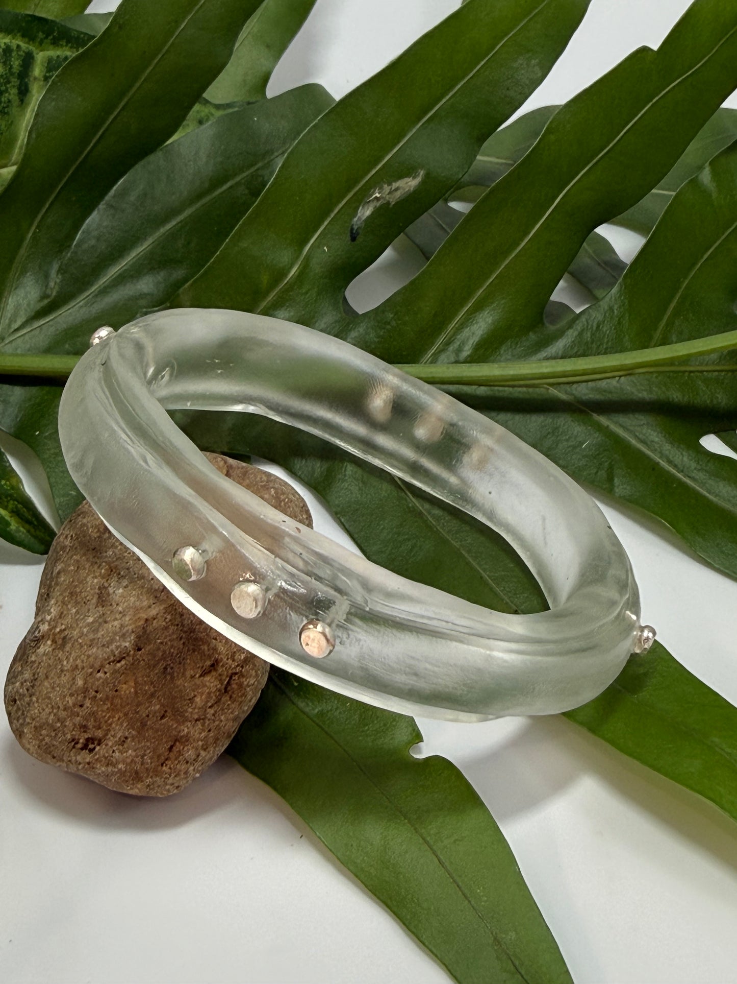 Clear resin rim bangle with sterling silver rivets