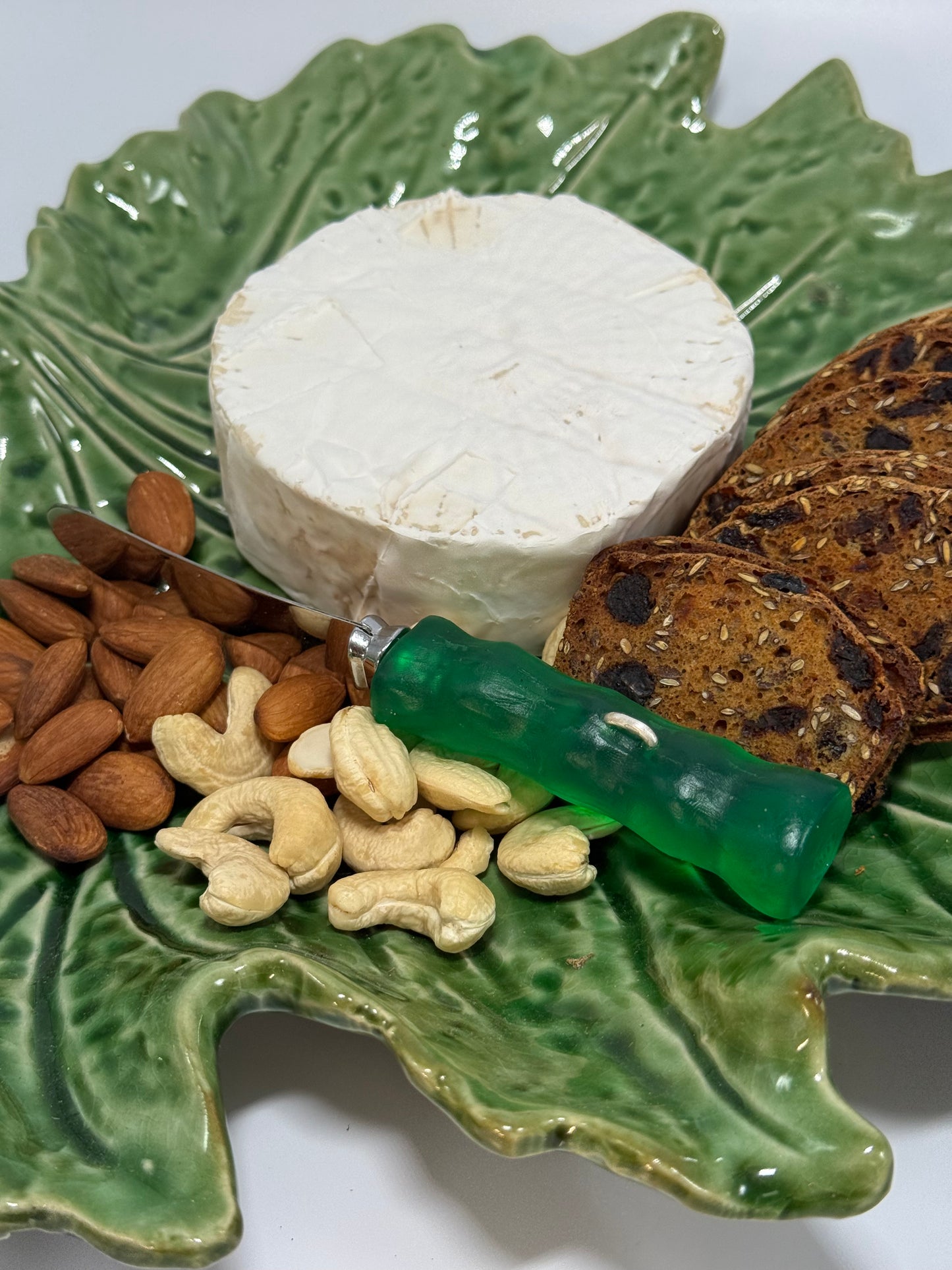 Cheese knife - Translucent Jade green with white specs resin - irregular shaped handle with silver staple insert