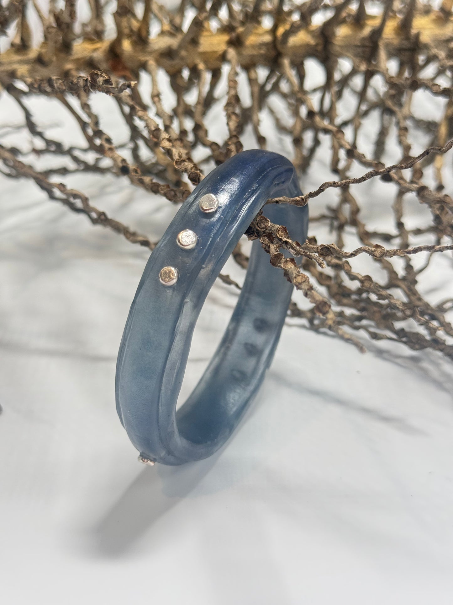 Translucent Navy Blue resin rim bangle with sterling silver rivets