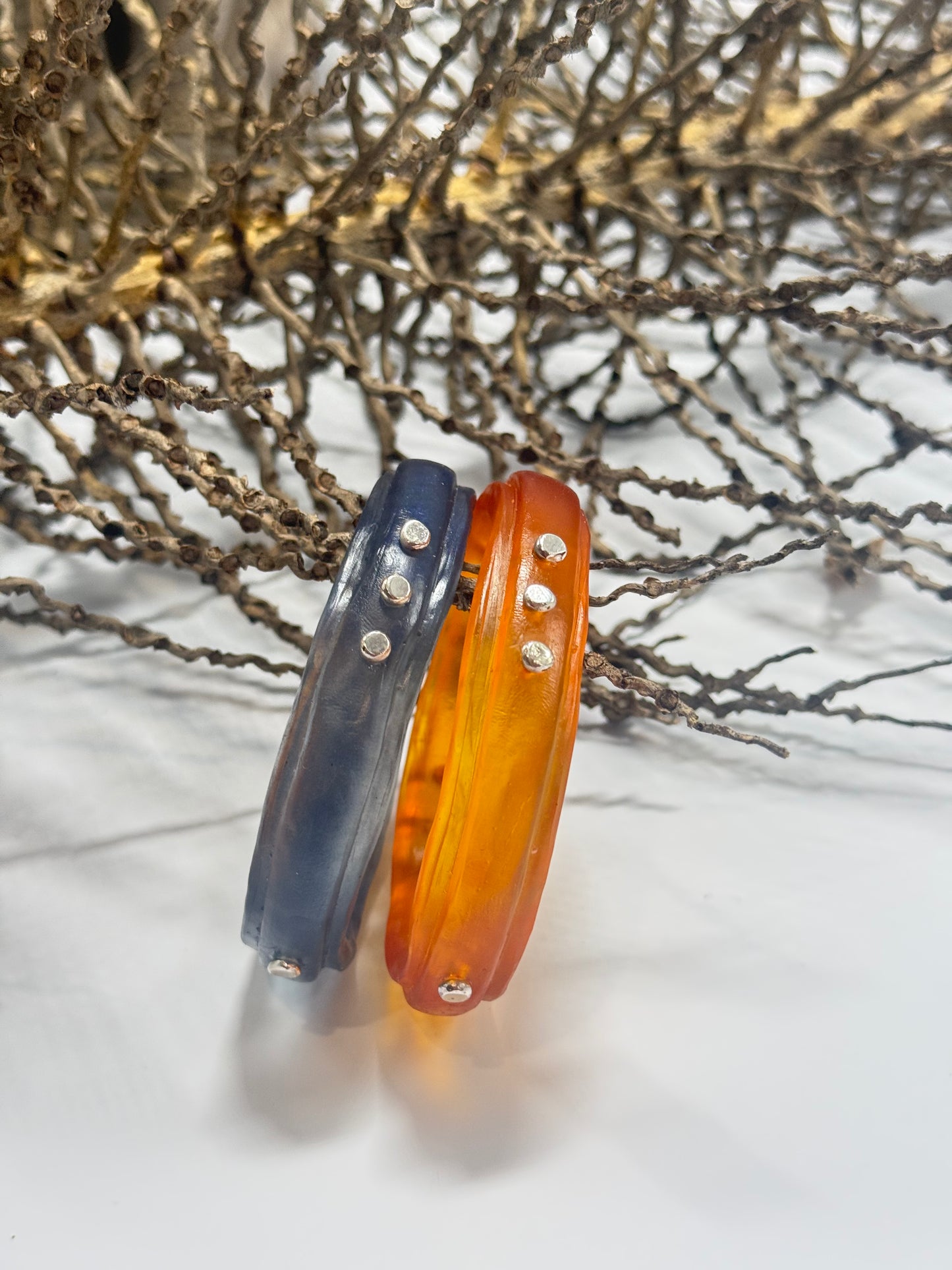 Translucent Navy Blue resin rim bangle with sterling silver rivets