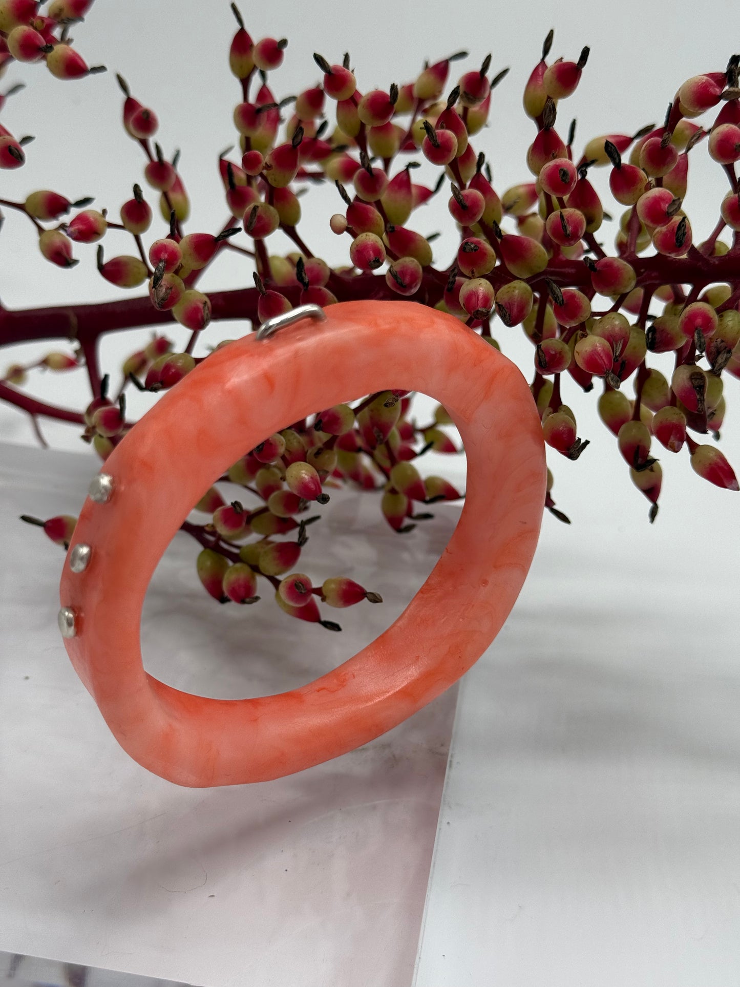 Orange/apricot swirl resin with silver rivets 'woopy' bangle
