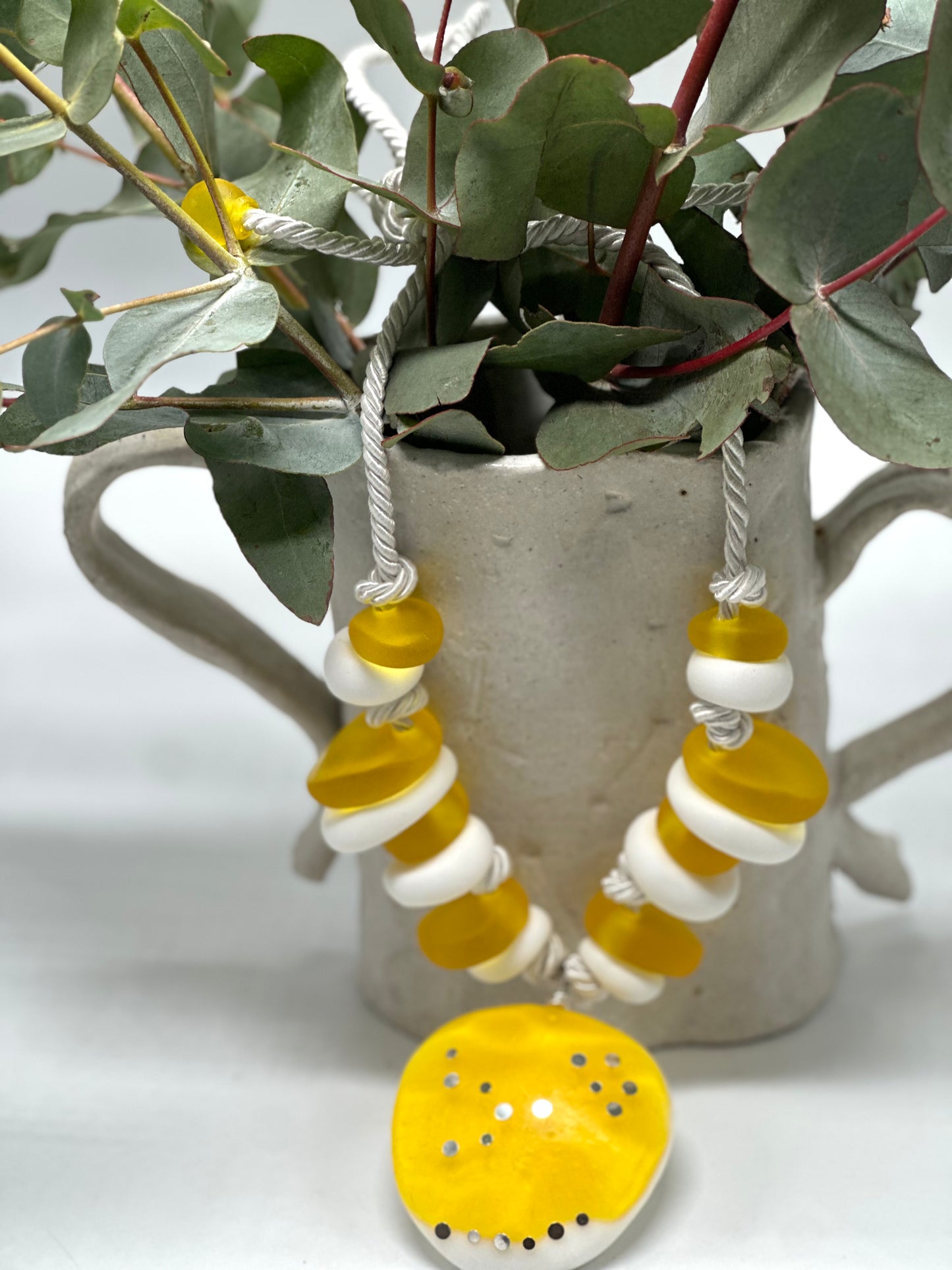 Yellow and white resin beads with pendant and sterling silver