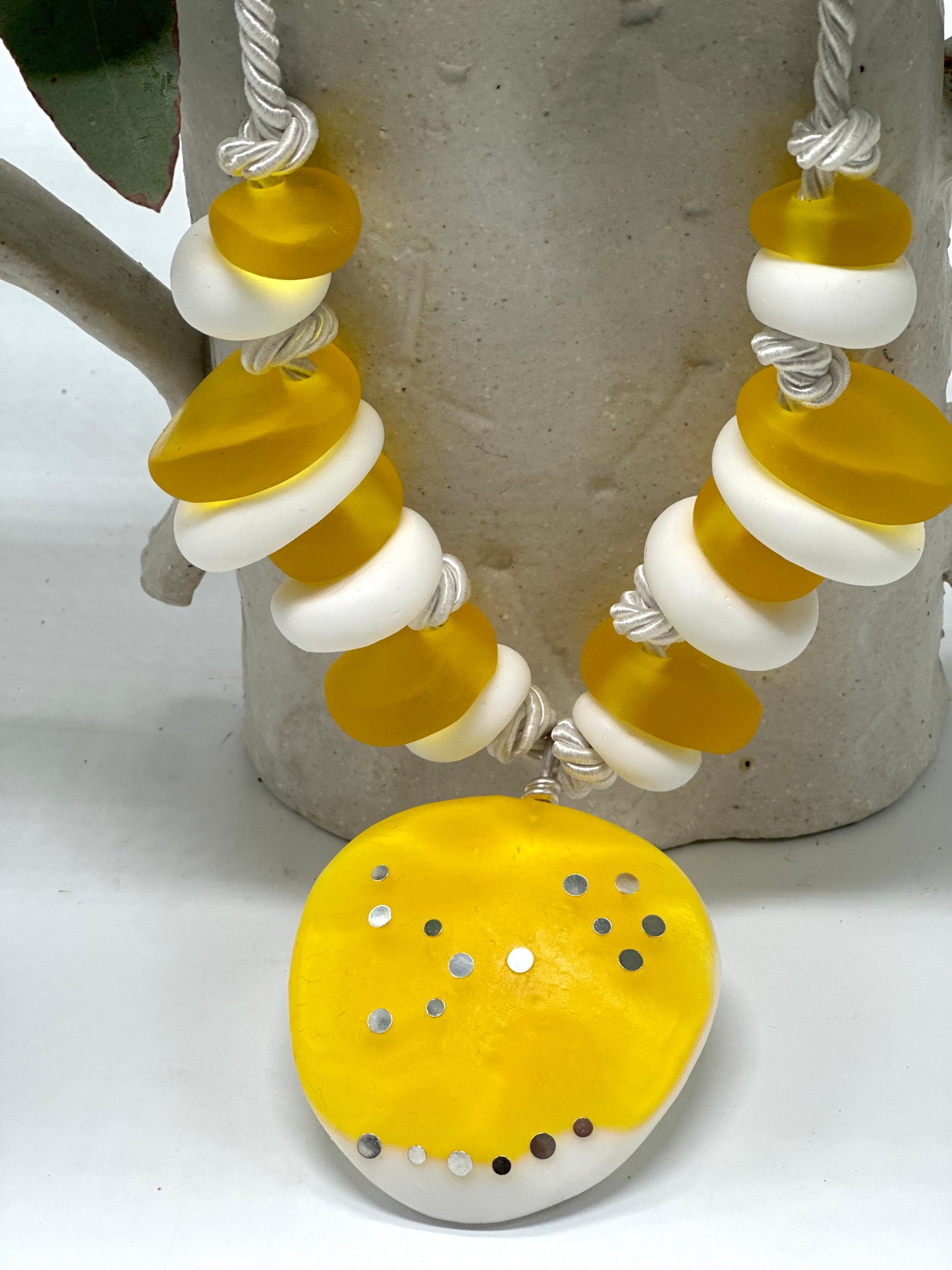 Yellow and white resin beads with pendant and sterling silver