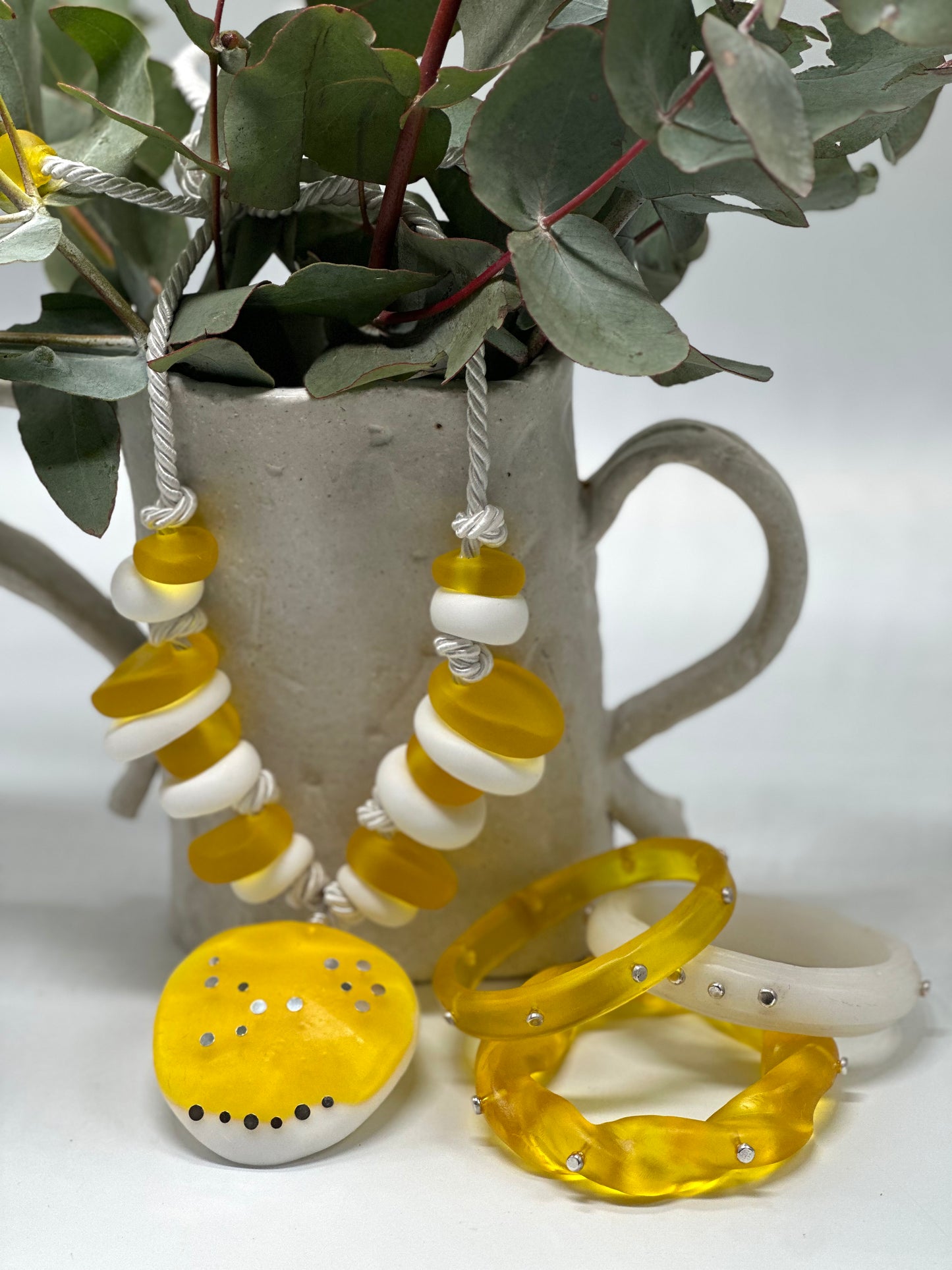 Yellow and white resin beads with pendant and sterling silver