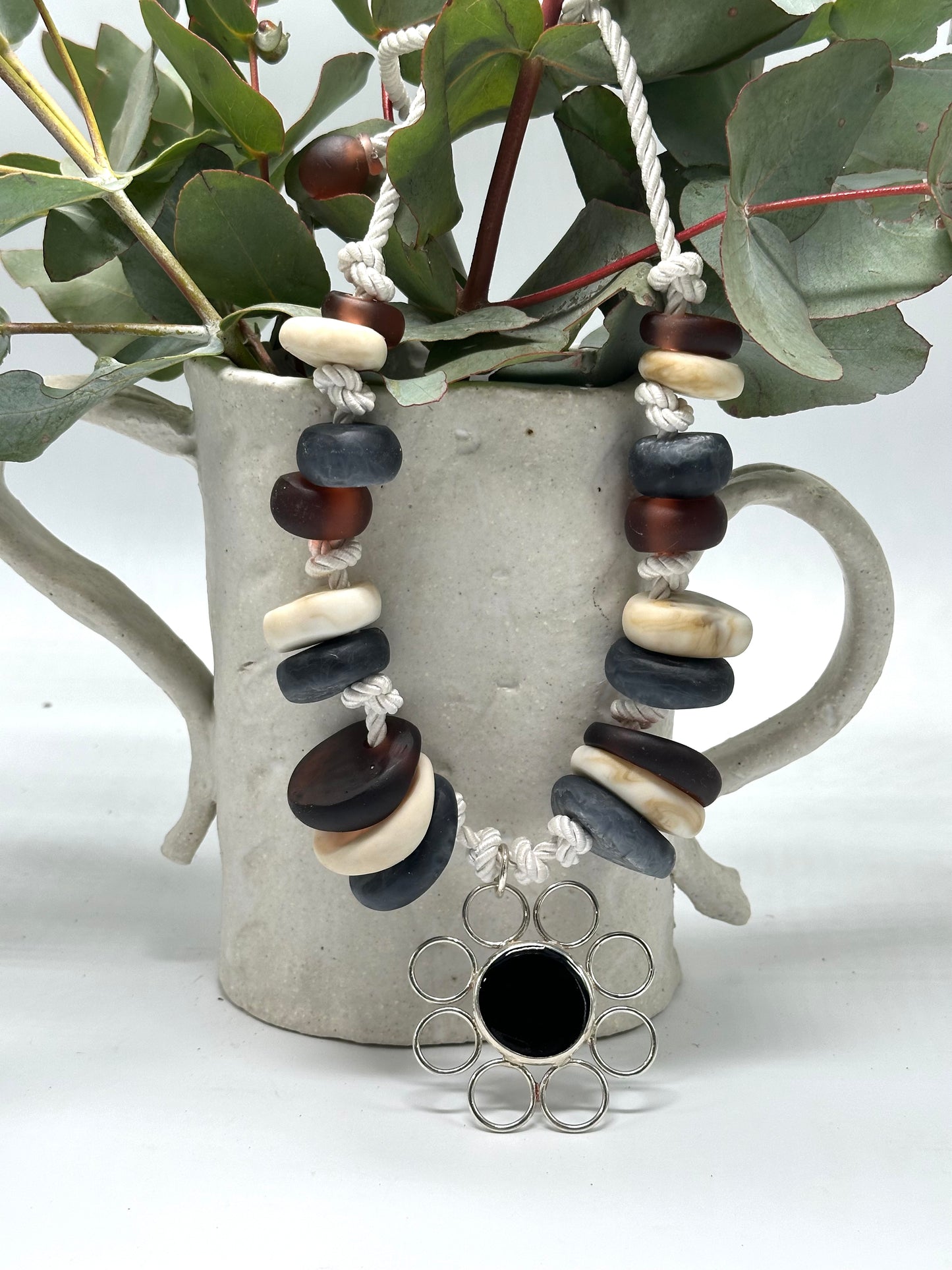 Natural Creams & Brown resin beads with sterling silver pendant