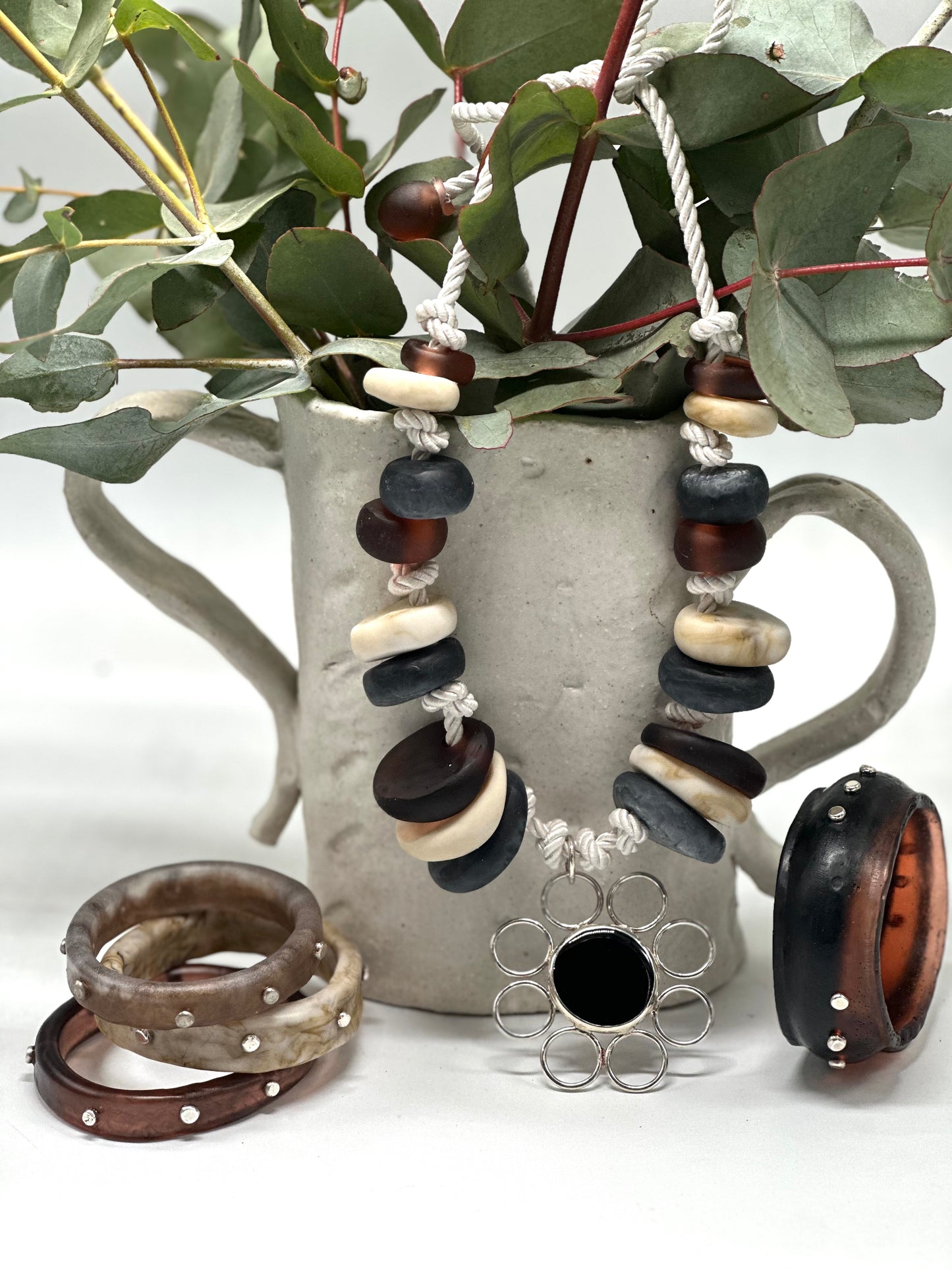 Natural Creams & Brown resin beads with sterling silver pendant