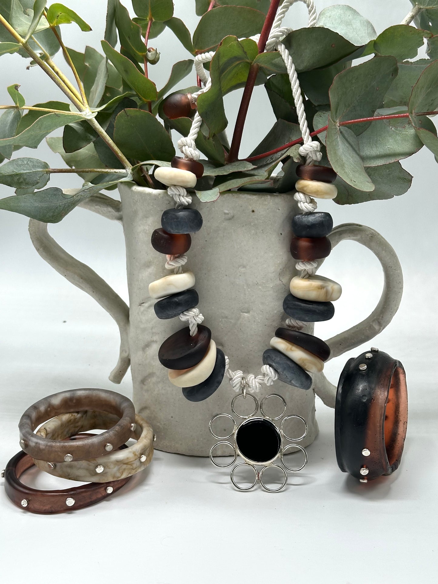 Natural Creams & Brown resin beads with sterling silver pendant