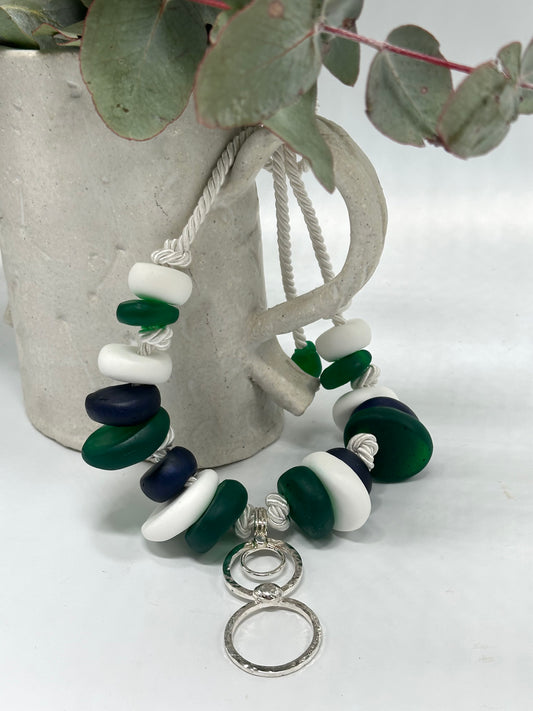 Navy, Green & white resin beads with silver circle pendant