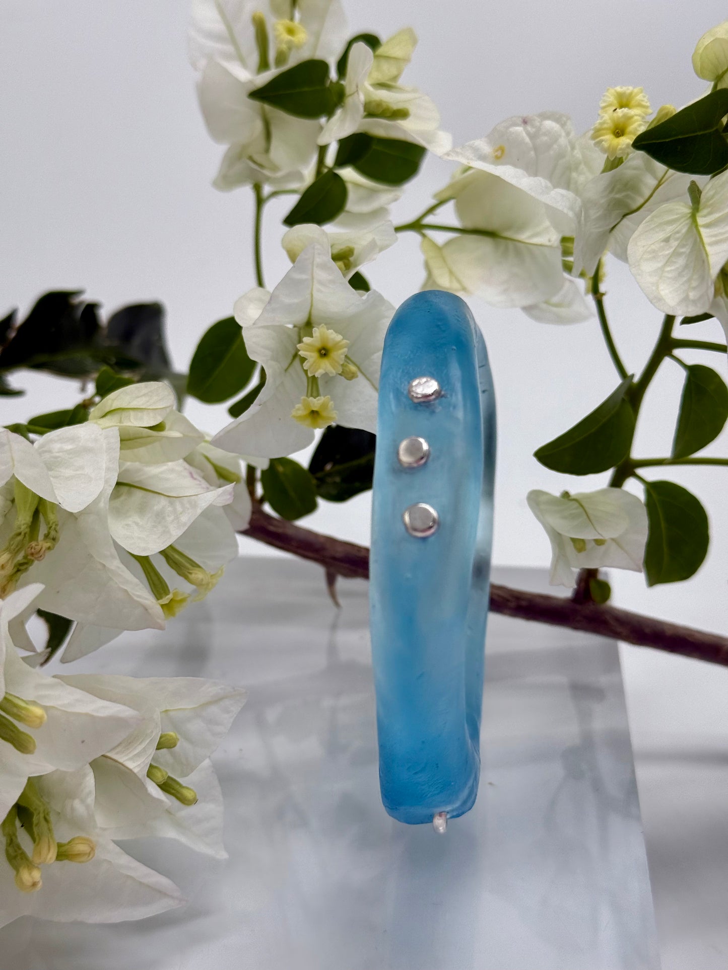 Translucent blue  resin and silver 'woopy' bangle - regular size