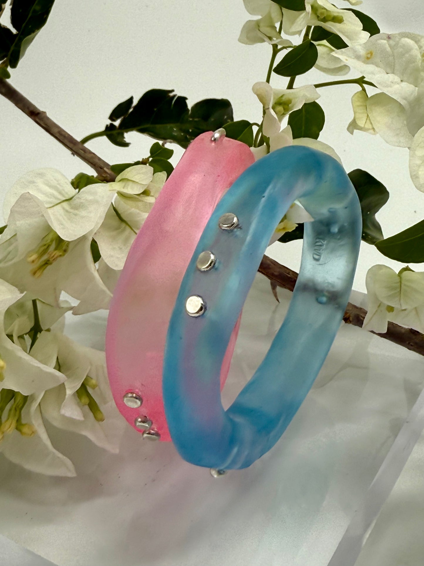 Translucent blue  resin and silver 'woopy' bangle - regular size
