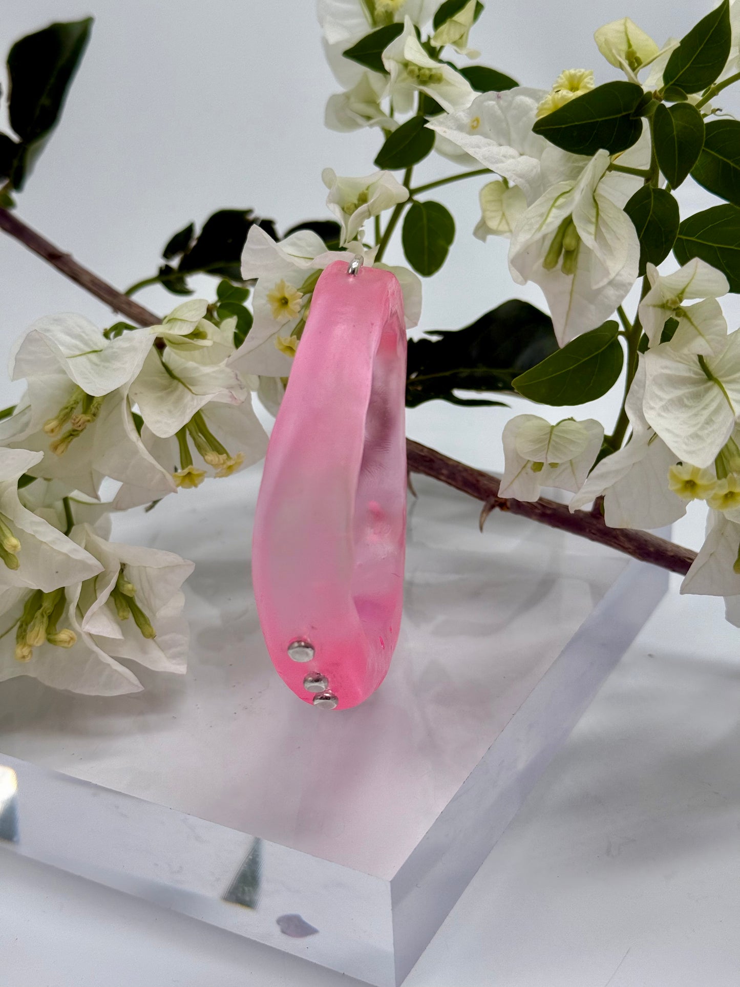 Translucent pink resin and silver 'woopy' bangle - regular size