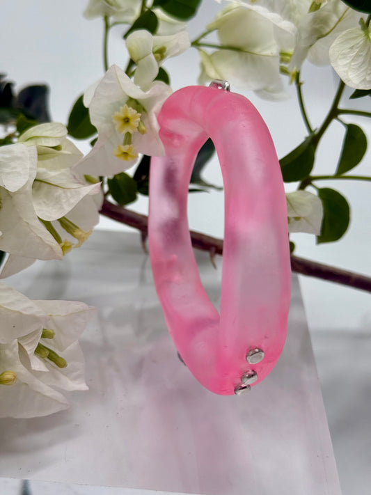 Translucent pink resin and silver 'woopy' bangle - regular size