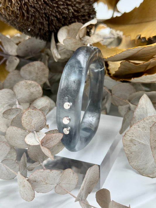 Translucent black resin and silver 'woopy' bangle - regular size