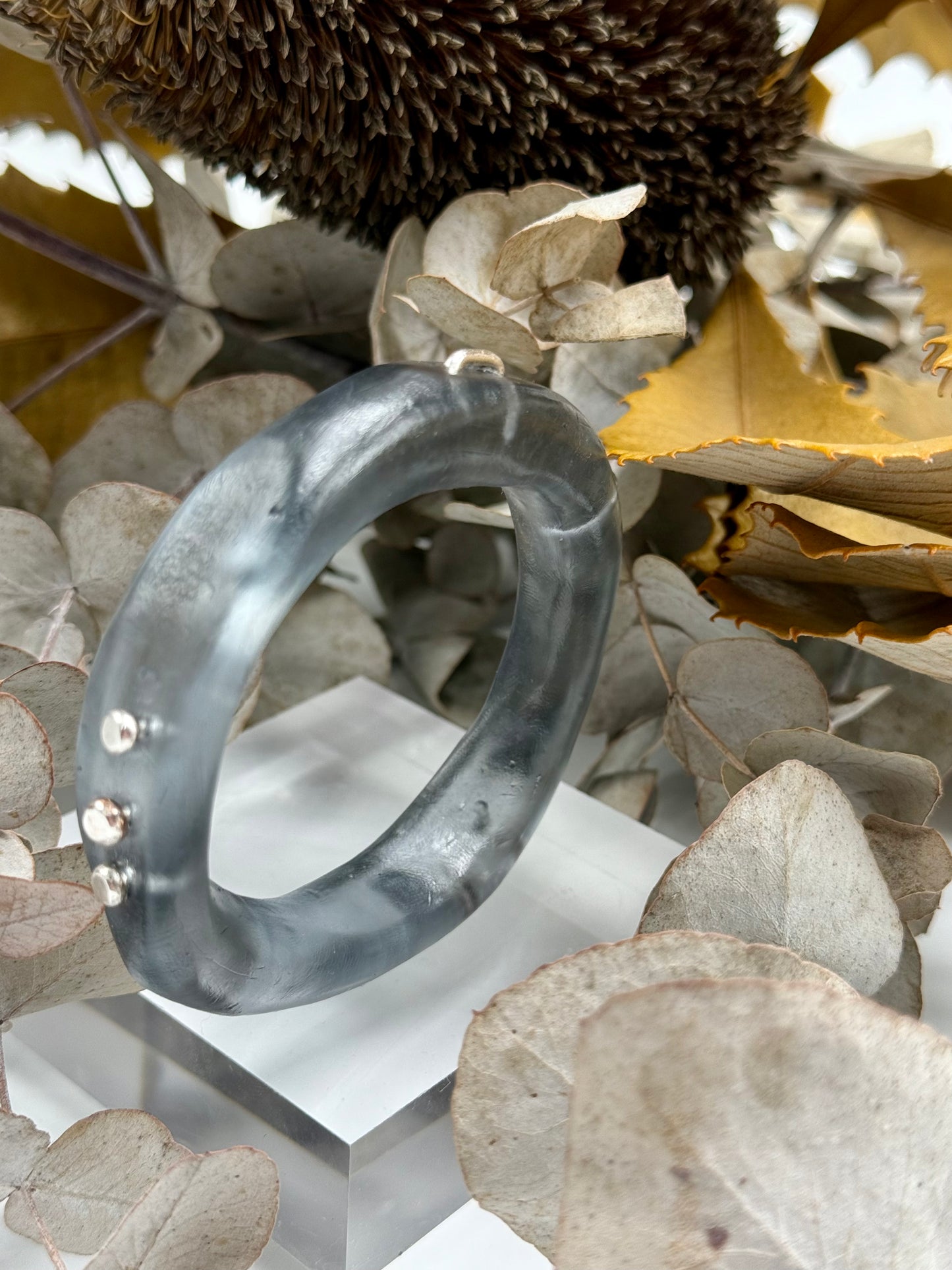 Translucent black resin and silver 'woopy' bangle - regular size
