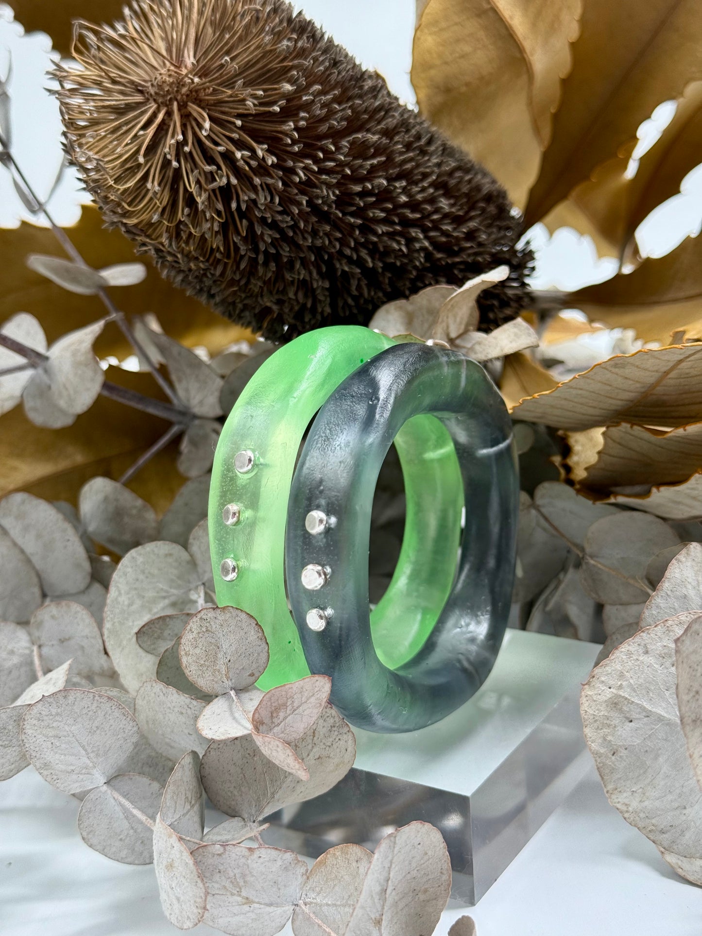 Translucent black resin and silver 'woopy' bangle - regular size