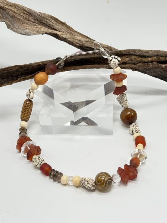 Neutral/brown coloured semi precious stones with Sterling silver catch