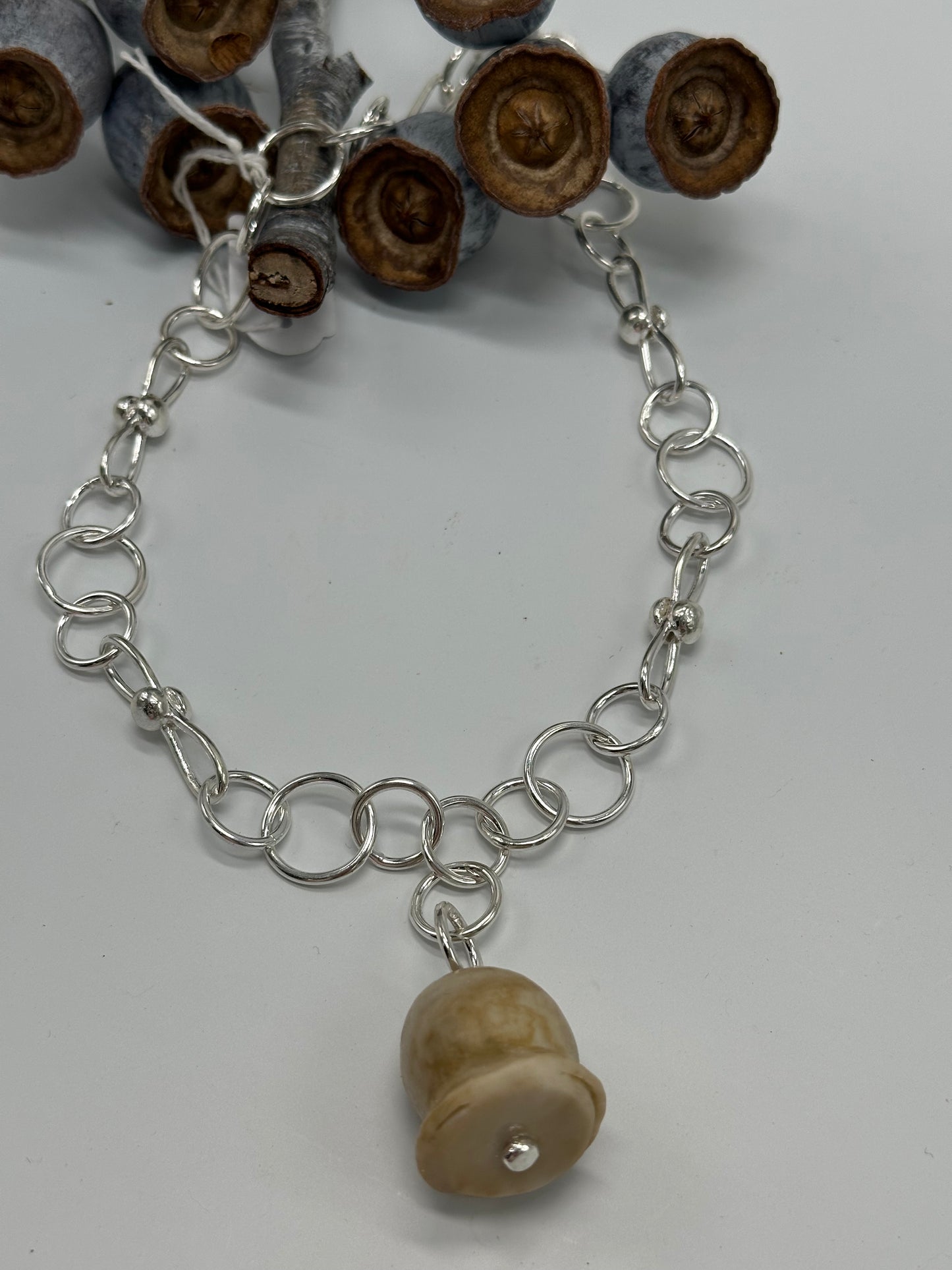Sterling silver chain with cream gumnut pendant