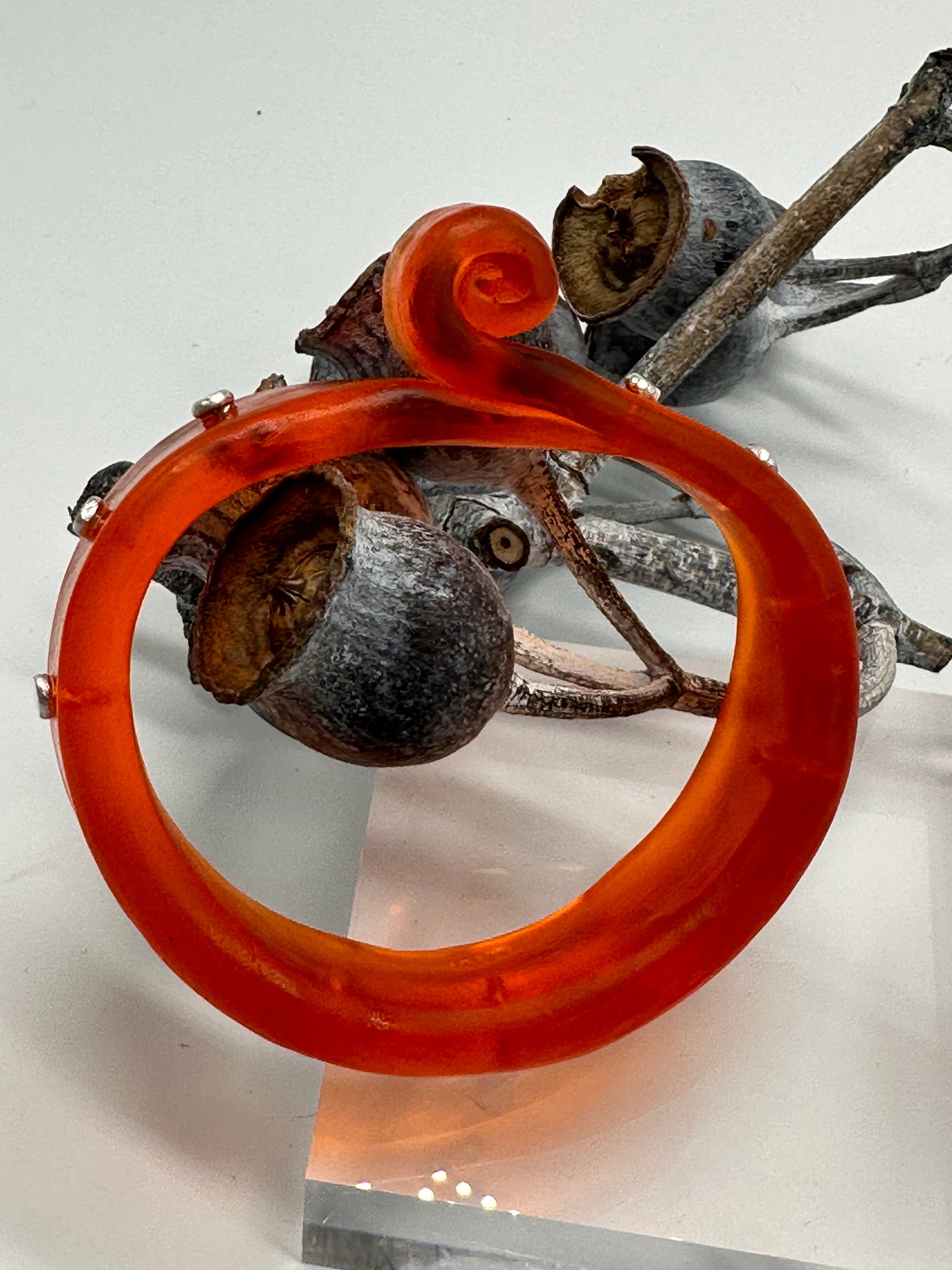 Orange 'Curl' Resin and silver bangle