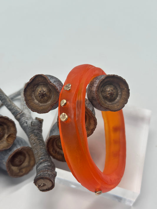 Orange rim bangle with gold nuggets