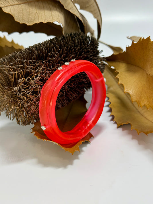 Neon Red resin rim bangle with sterling silver rivets