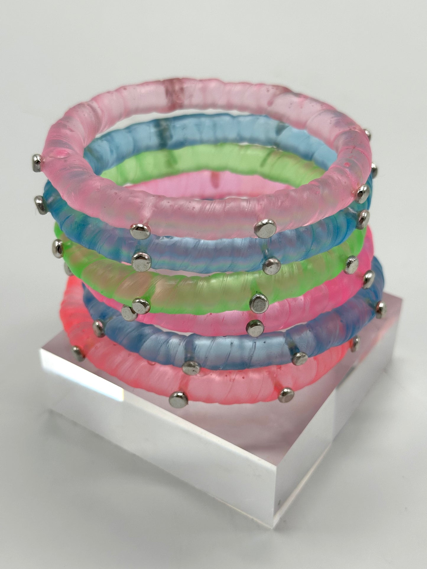 Translucent Coral resin and sterling silver rivet 'simple twist' classic bangle