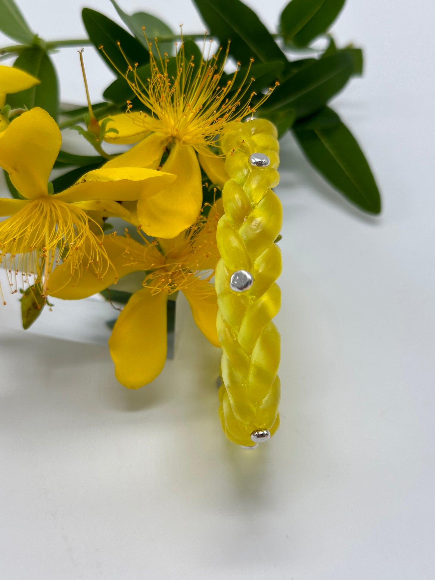 Yellow resin and sterling silver rivet plaited classic bangle