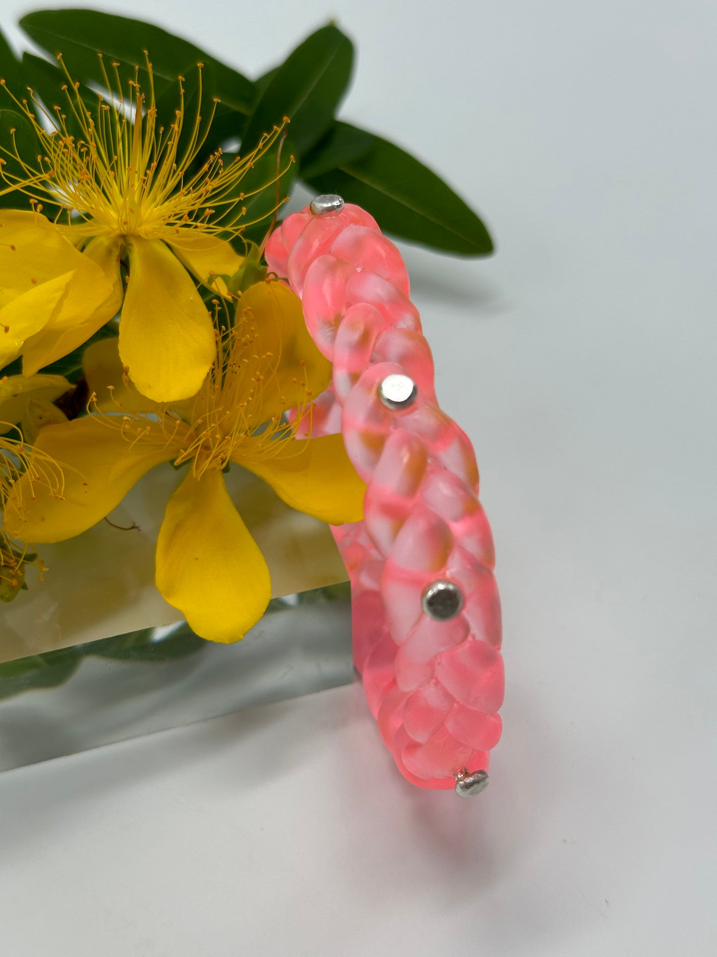 Neon Translucent Coral resin and sterling silver rivet plaited classic bangle
