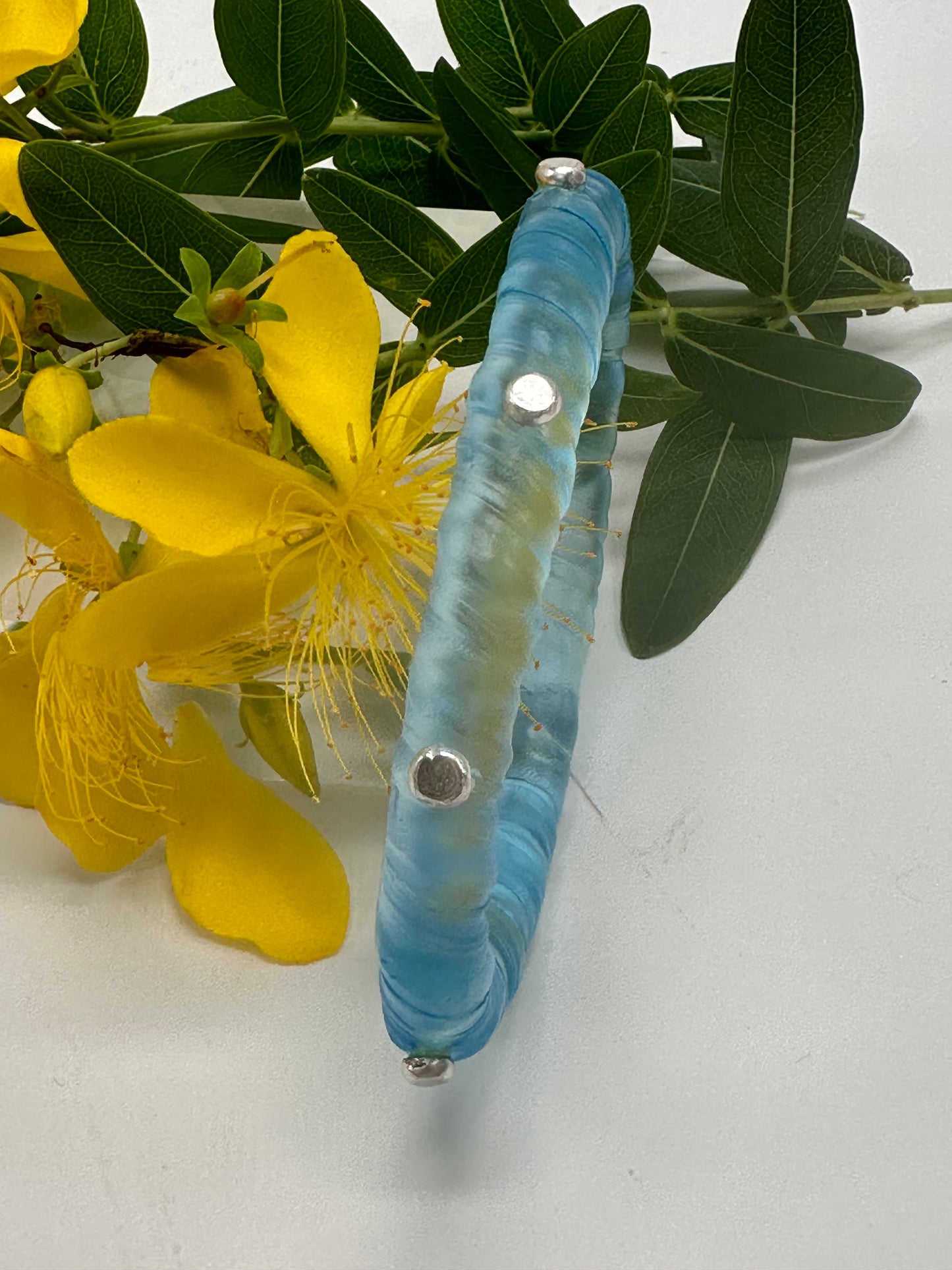 Pale Translucent Blue resin and sterling silver rivet 'simple twist' classic bangle