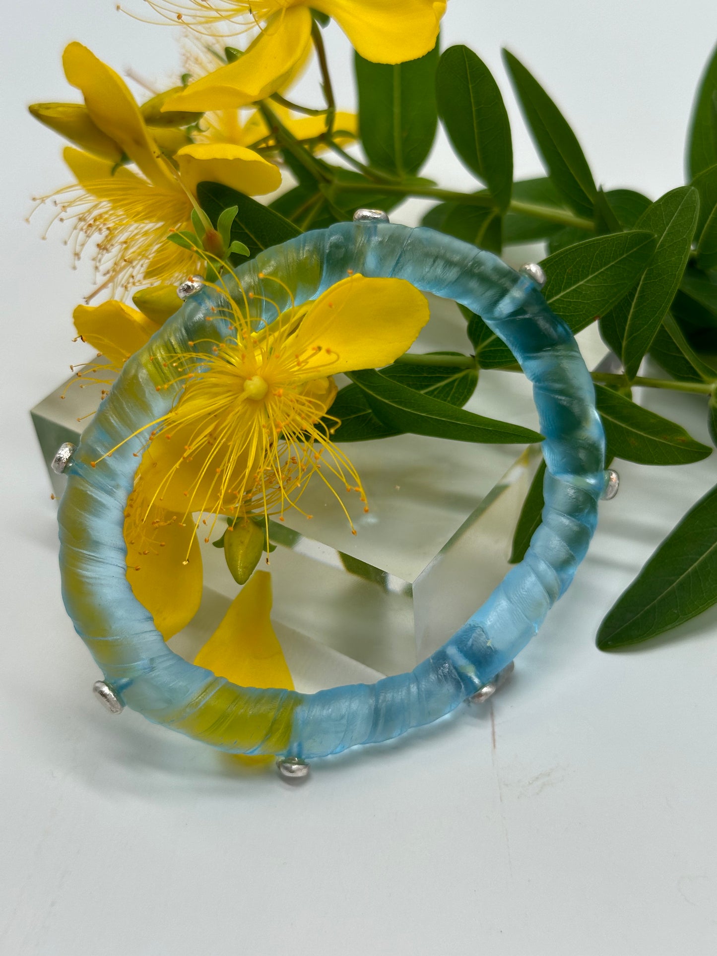 Pale Translucent Blue resin and sterling silver rivet 'simple twist' classic bangle