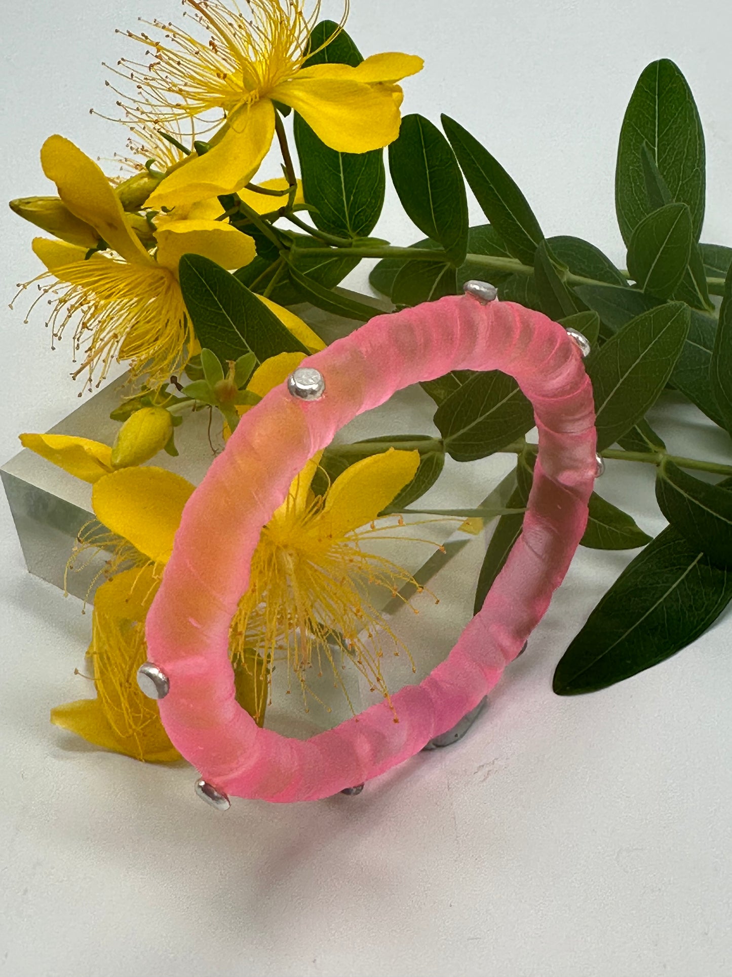 Neon Translucent Pink resin and sterling silver rivet 'simple twist' classic bangle